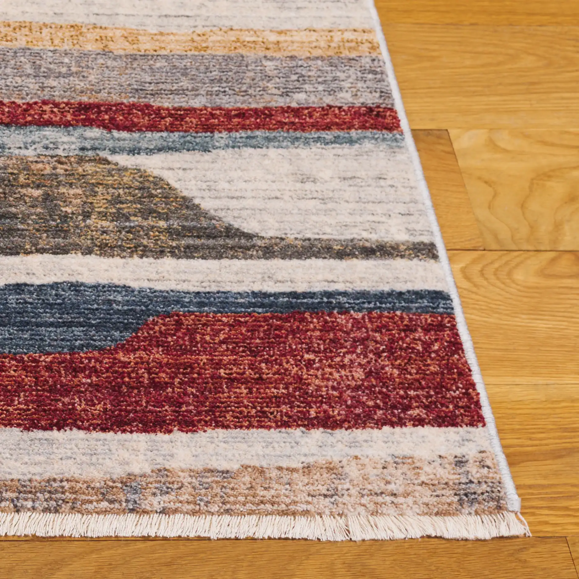Forum Abstract Stripe Rug in Ivory / Rust Blue in a styled room