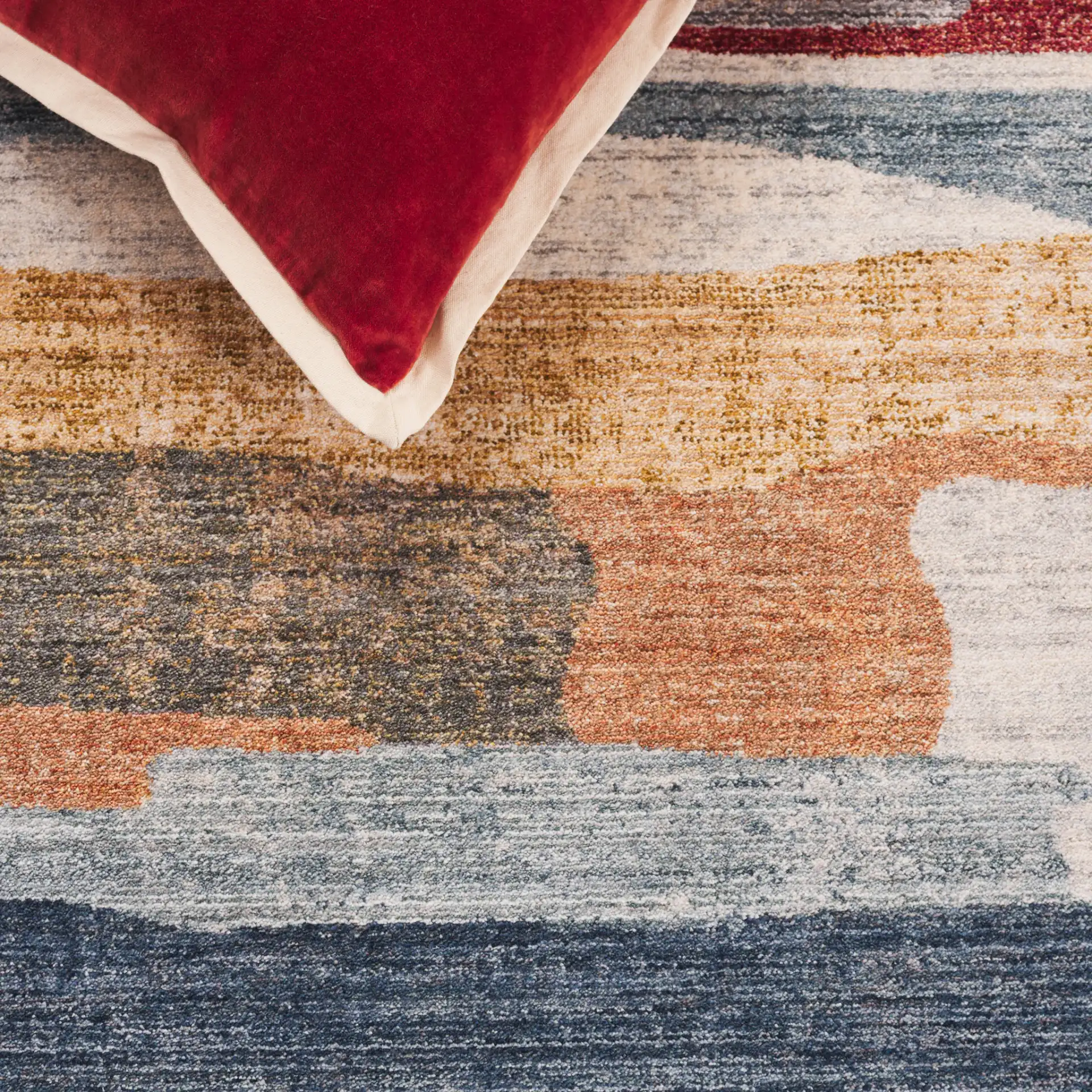 Forum Abstract Stripe Rug in Ivory / Rust Blue in a styled room