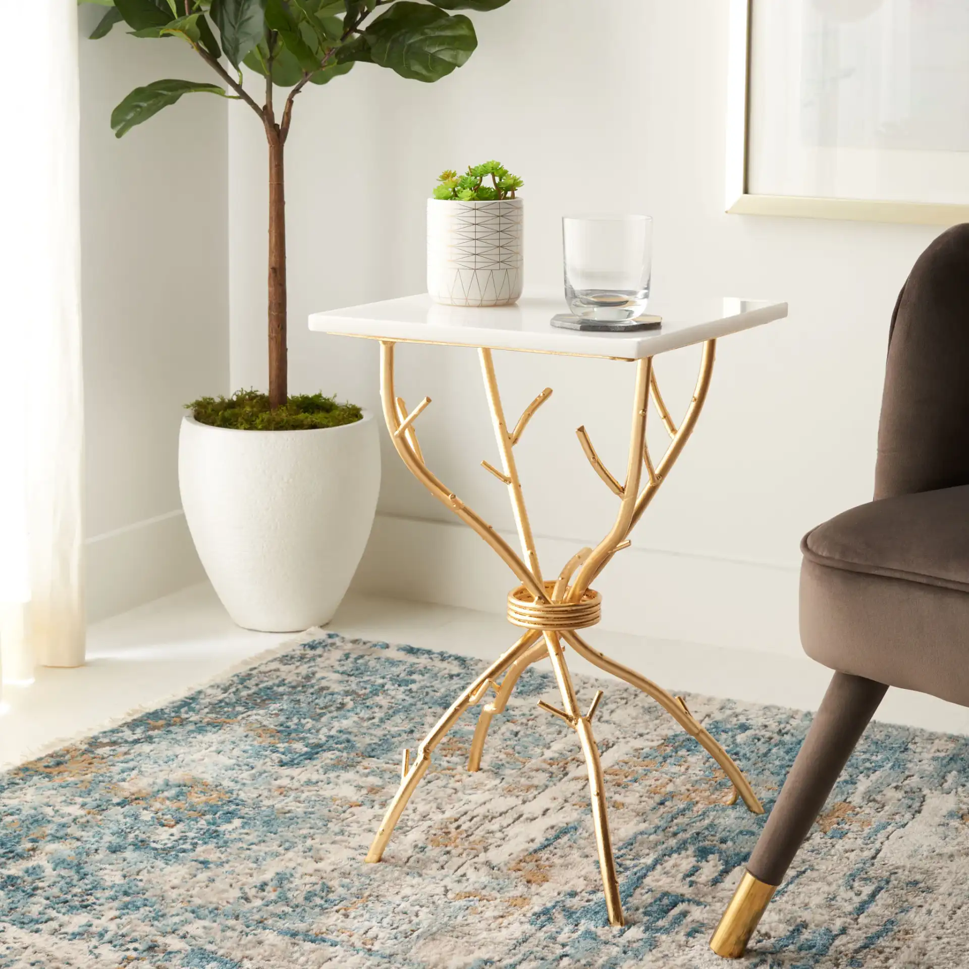 Alexa Accent Table in Black / Silver in a styled room