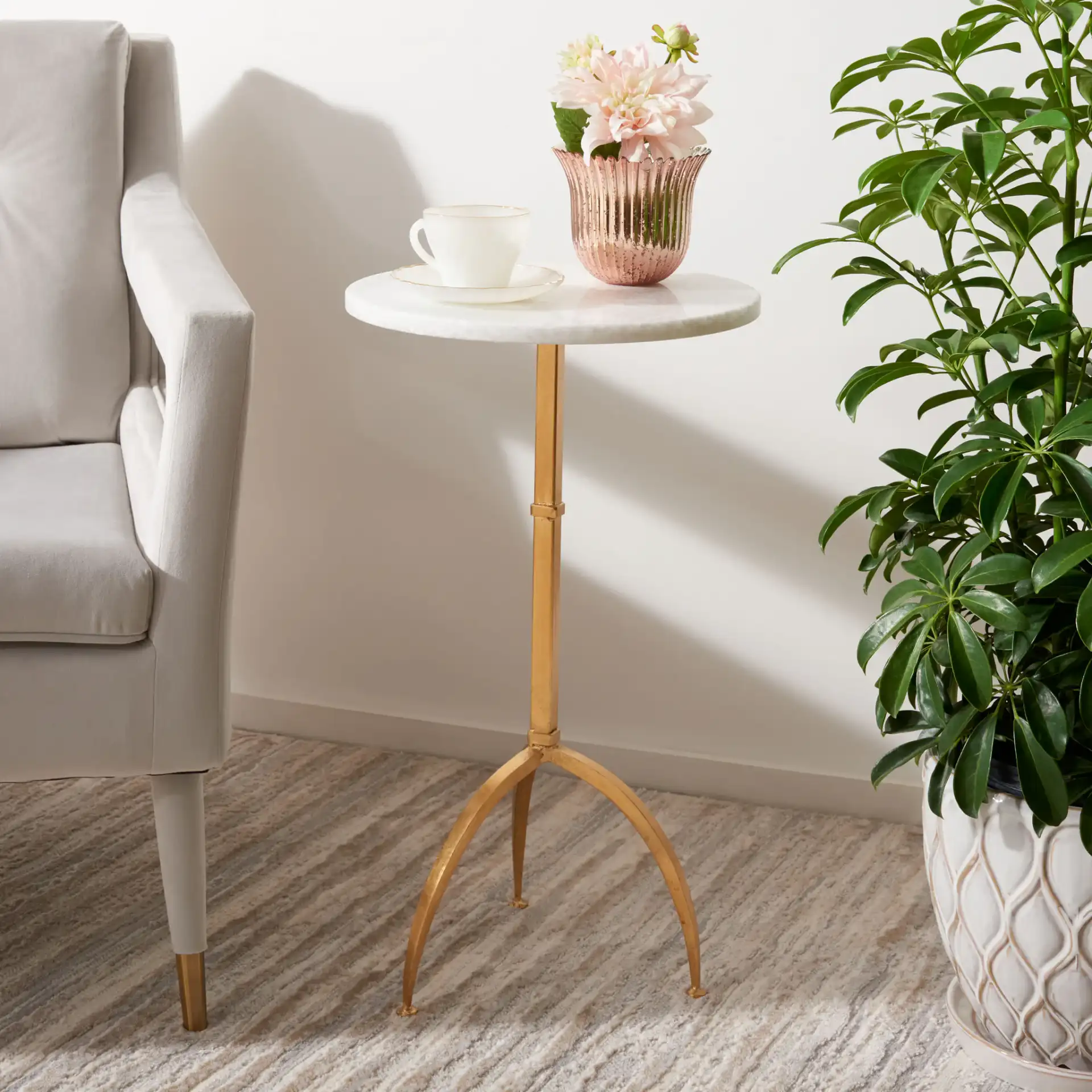 Myrna Accent Table in Gold / White Granite in a styled room