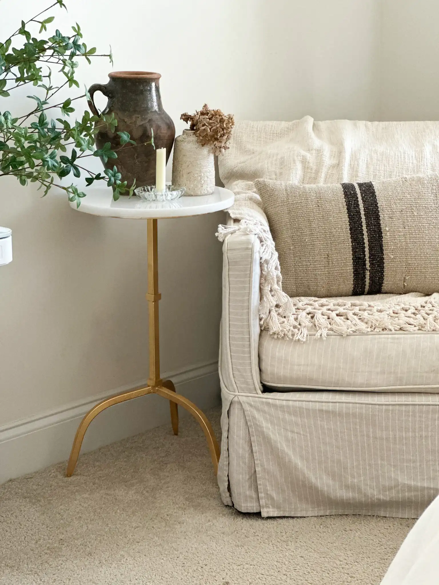 Myrna Accent Table in Gold / White Granite in a styled room