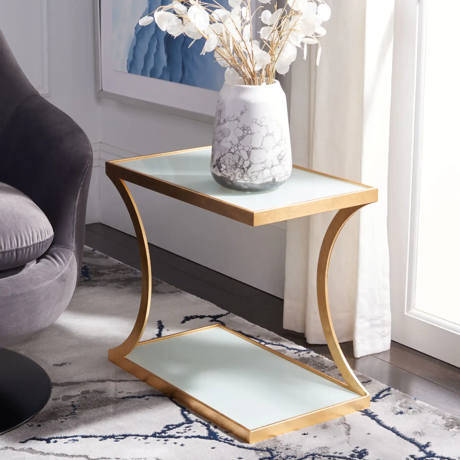 Sullivan Accent Table in Gold / White Clear in a styled room