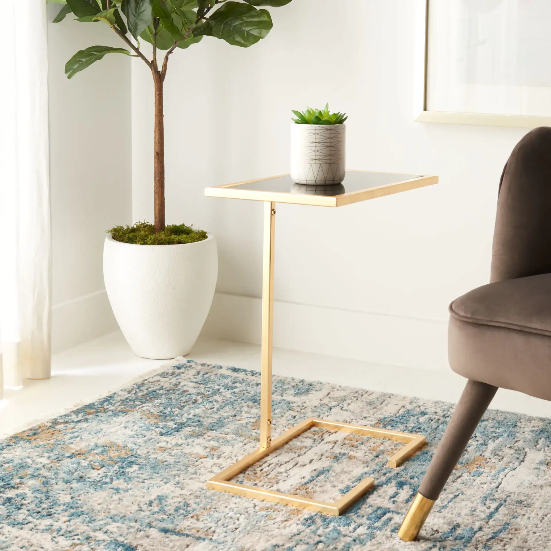 Neil Accent Table in Gold / White Clear in a styled room
