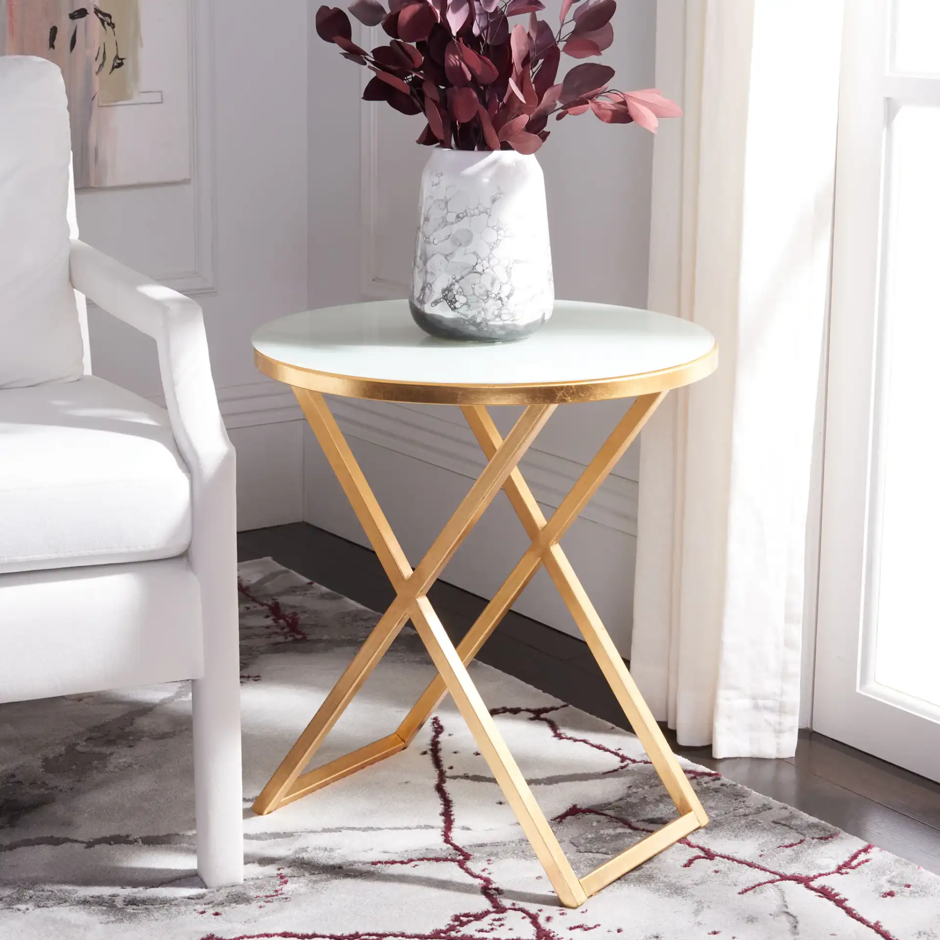 Riona Accent Table in Gold / White Clear in a styled room