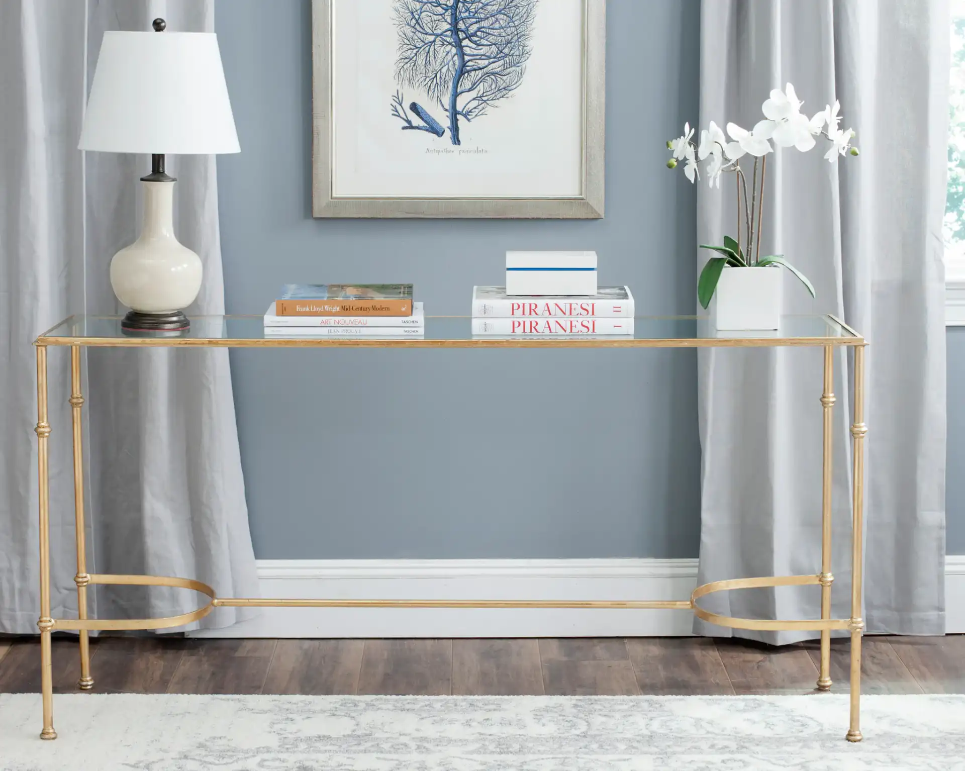 Lucille Console in Gold / Clear in a styled room