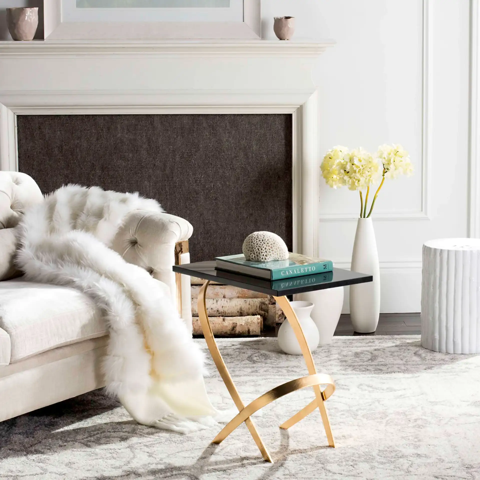 Dovie Side Table in Gold / Black in a styled room
