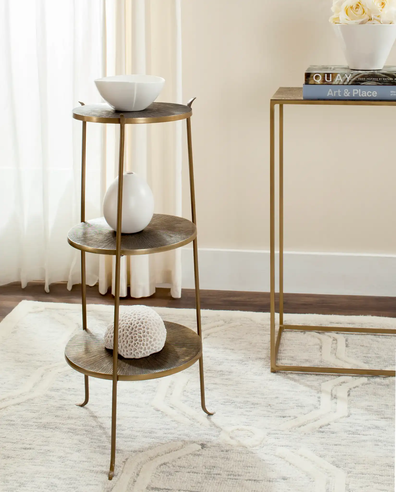 Elda Side Table in Brass in a styled room