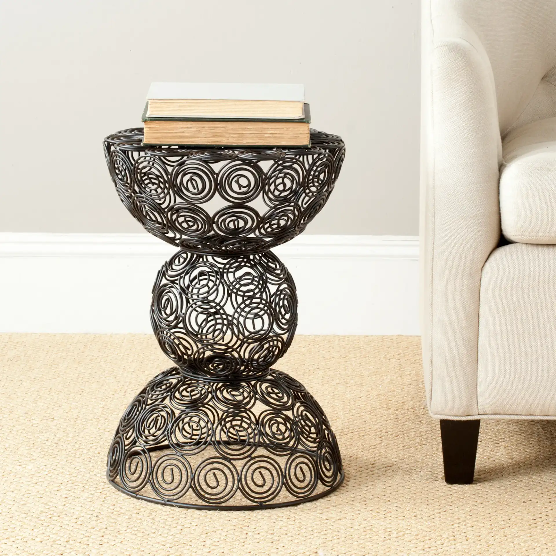 Leila Iron Circle Stool in Black in a styled room