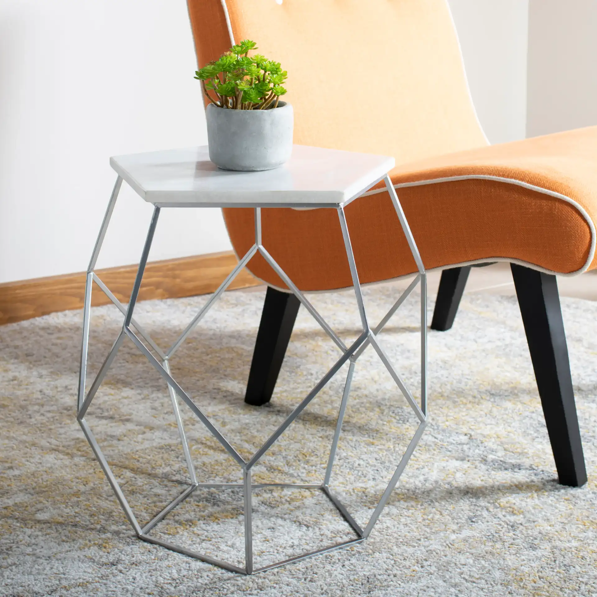 Abella Pentagon Accent Table in Marble / Silver in a styled room