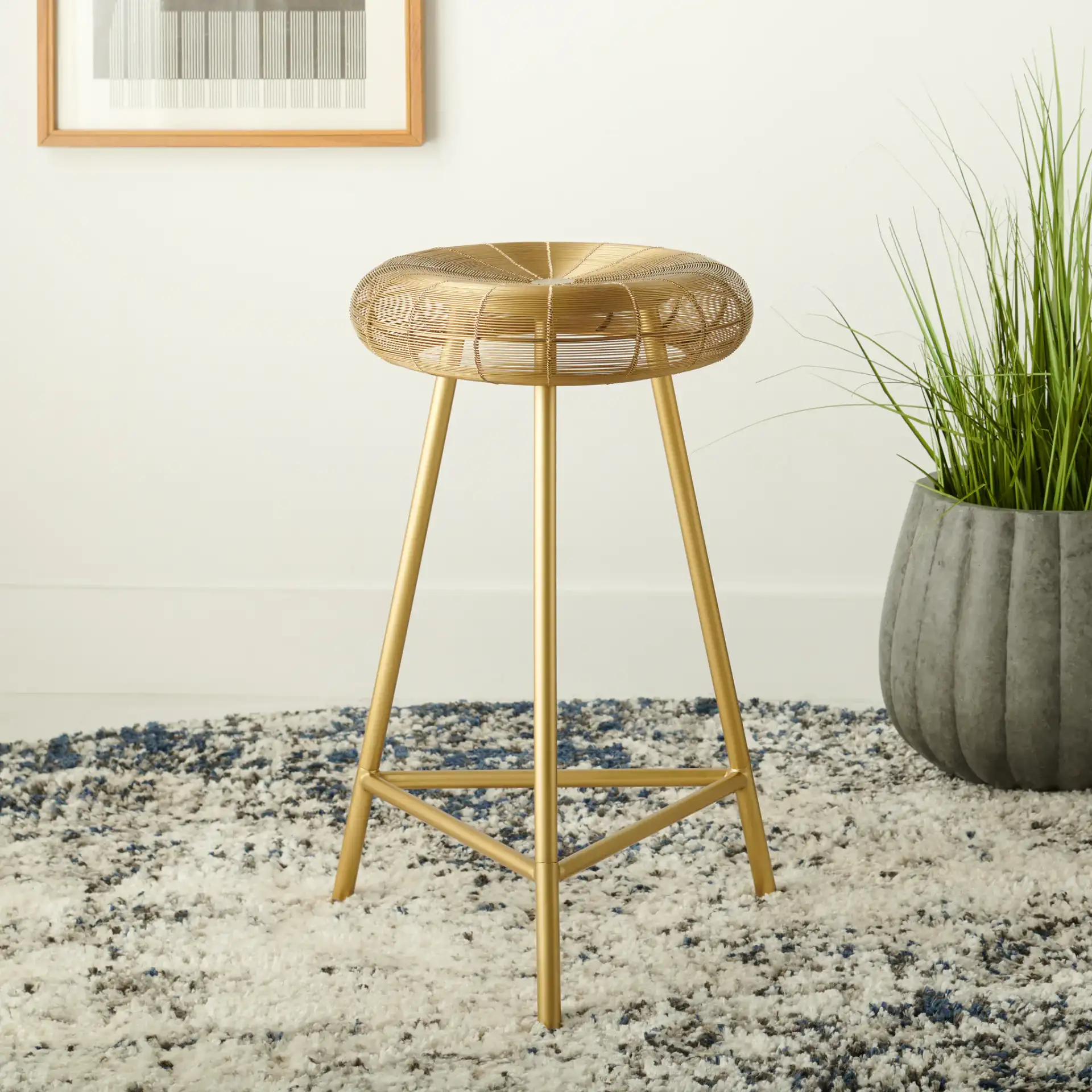Addison Barstool in Gold in a styled room