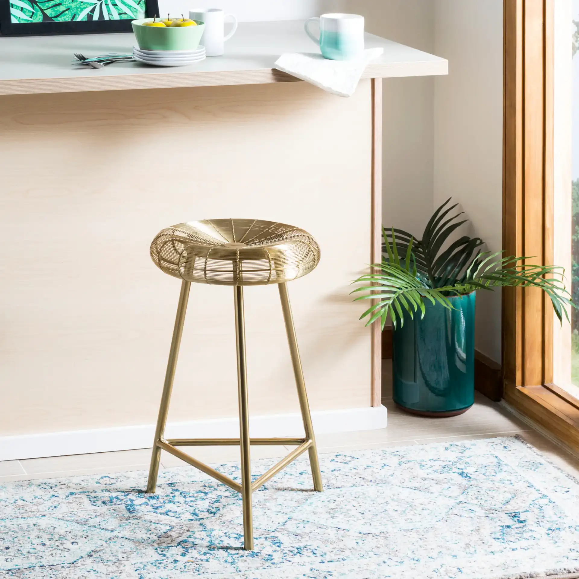 Addison Counterstool in Gold in a styled room