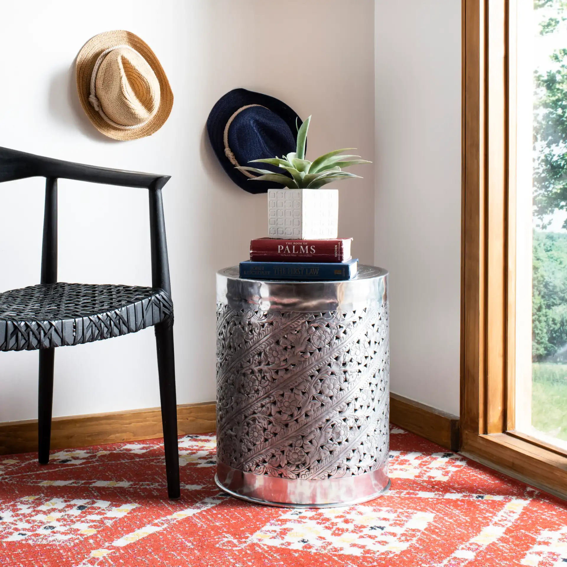 Adrien End Table in Silver in a styled room