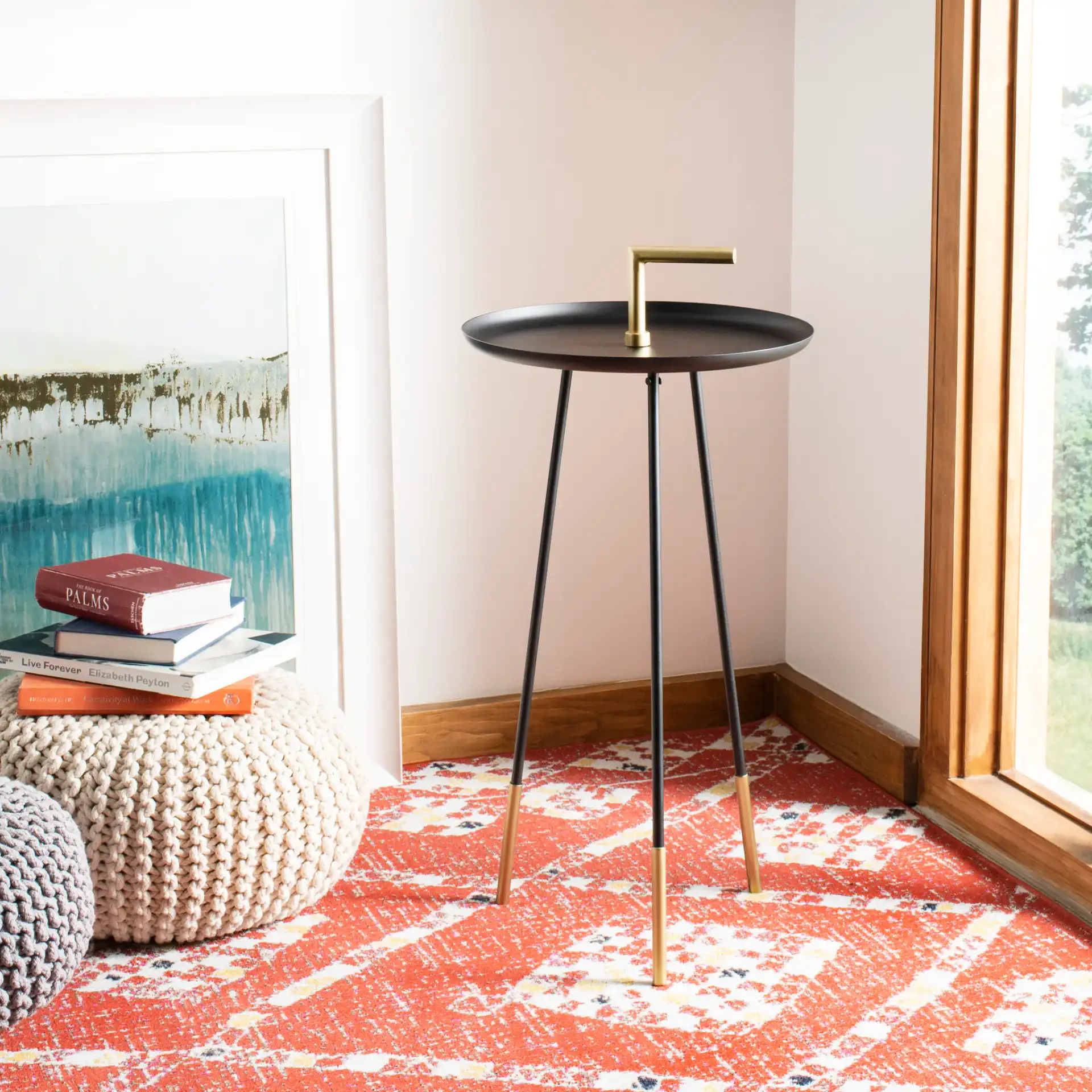 Delia Handle Side Table in Black / Gold in a styled room