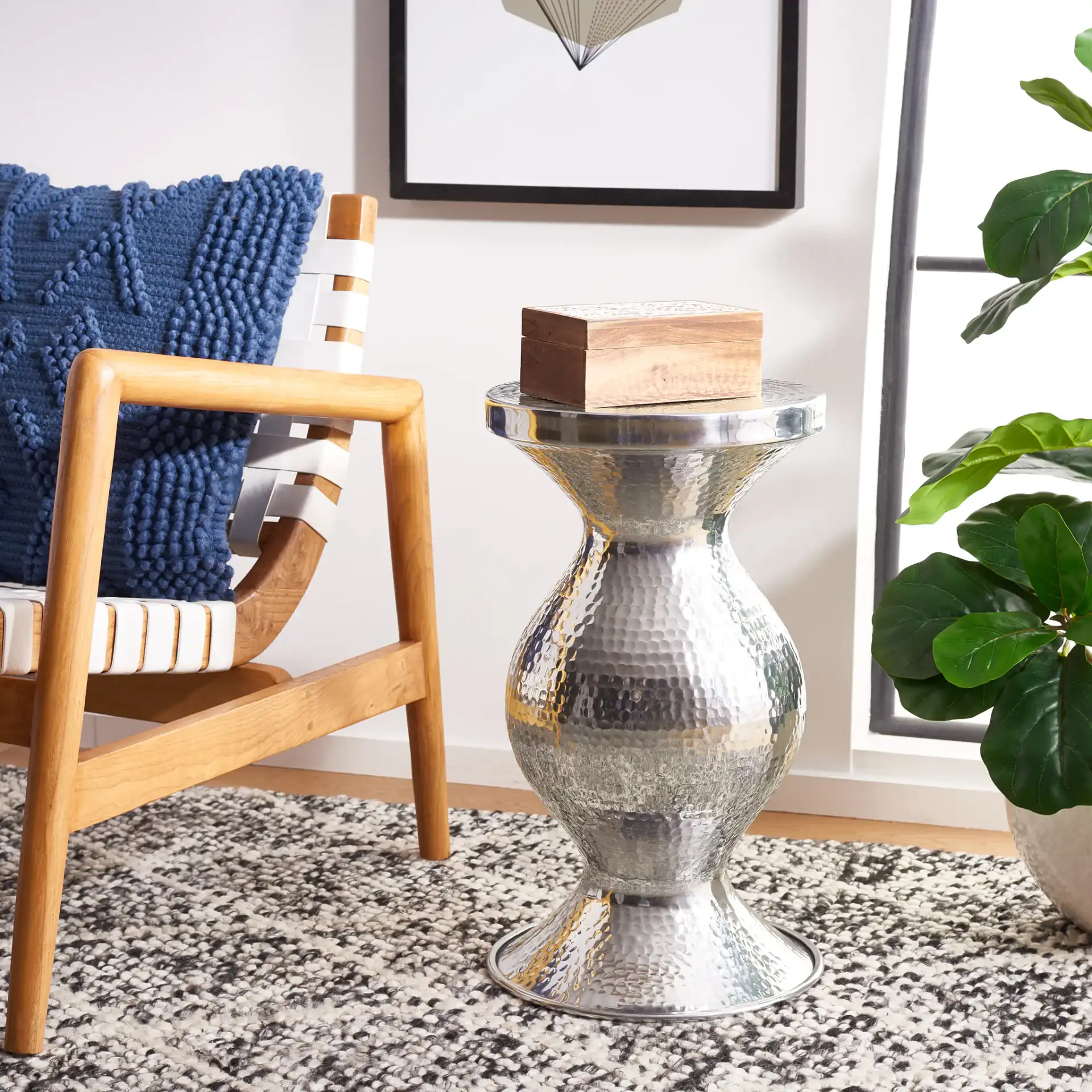Astrid Small Hammered Stool in Dark Gray in a styled room