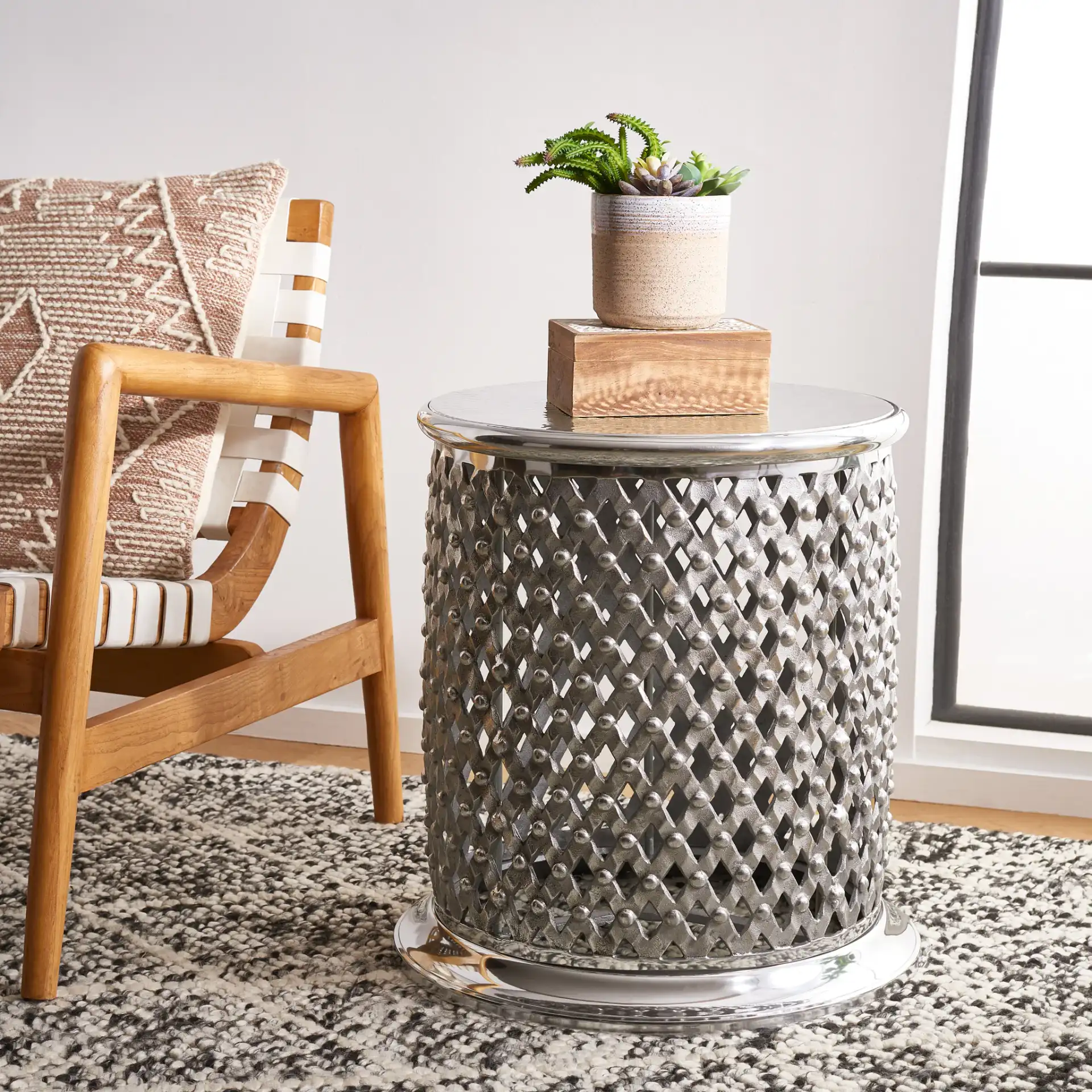 Metal Lace Table Stool in Silver in a styled room