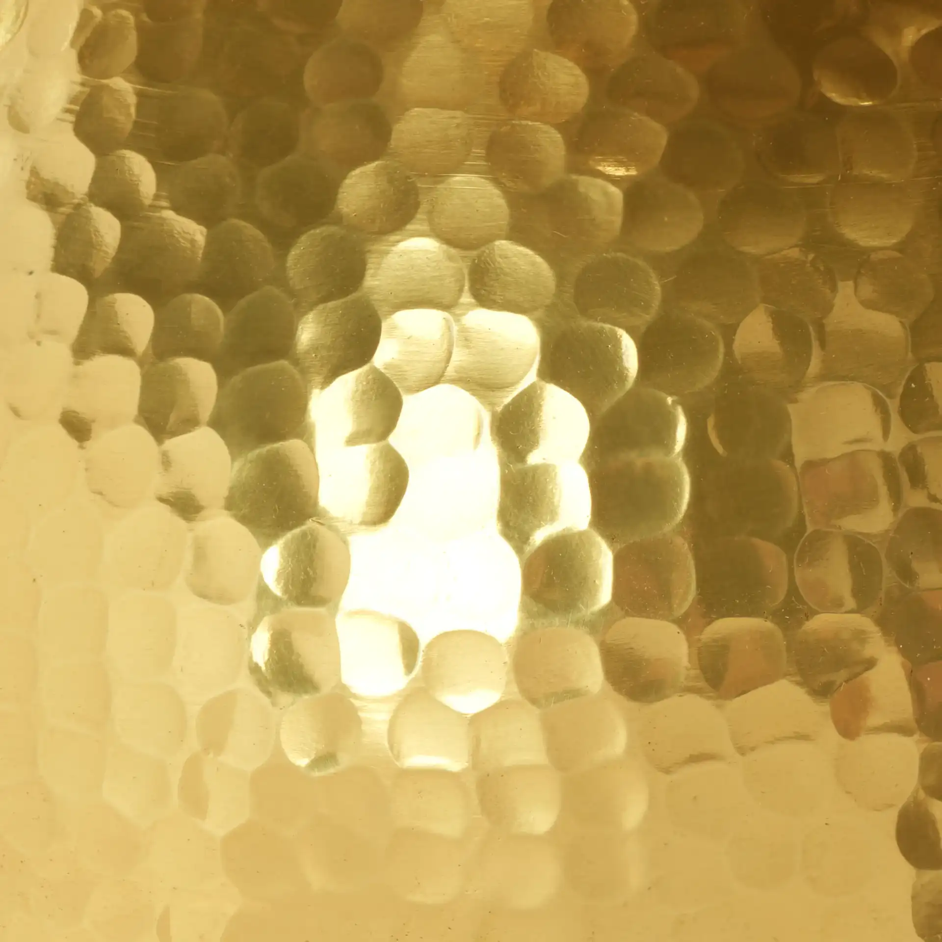 Janus Hammered Stool in Gold, detail view
