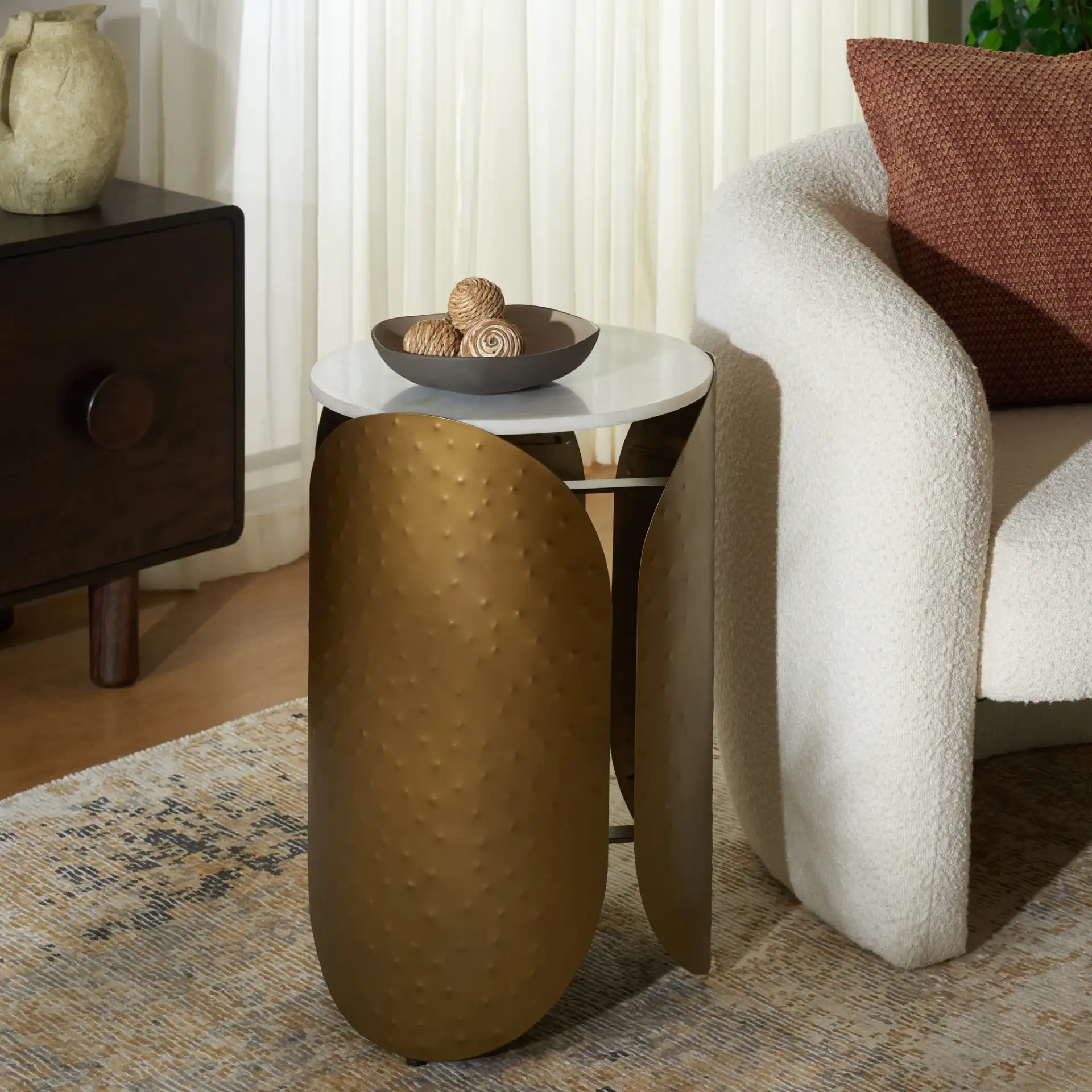 Shiara Round Accent Table in White Marble / Antique Brass in a styled room