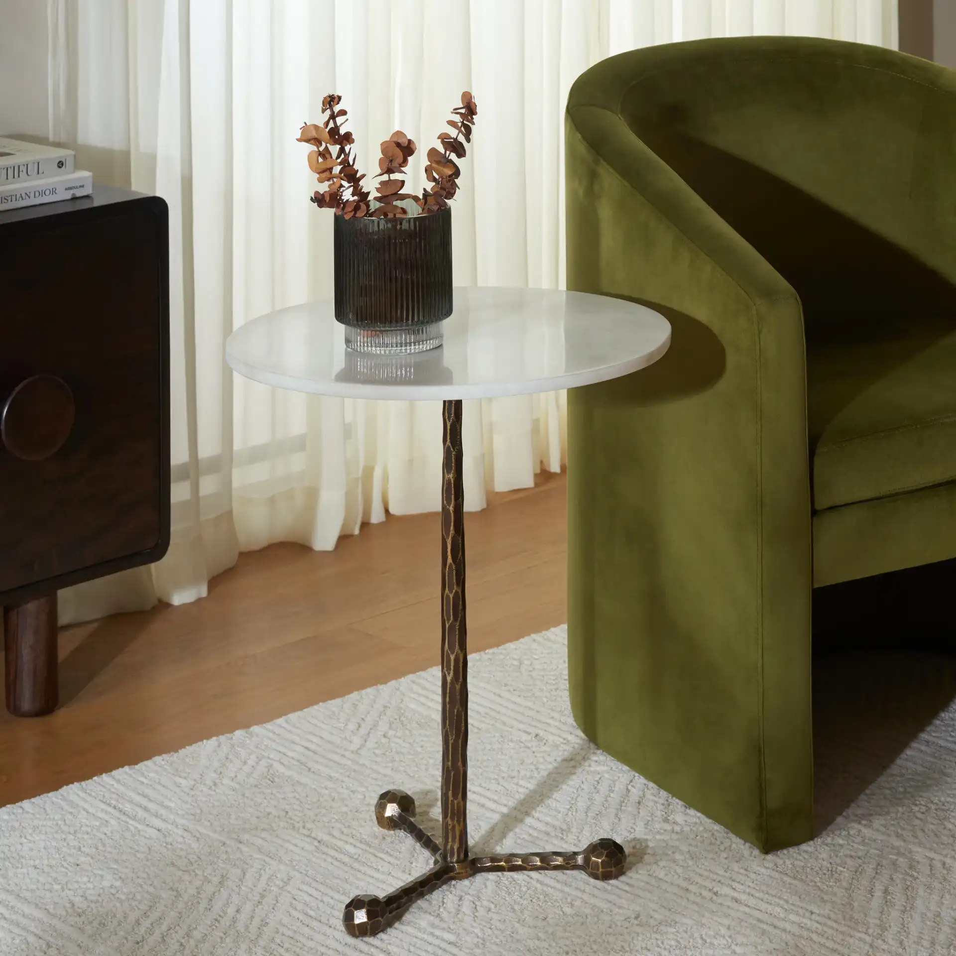 Sizia Round Accent Table in White Marble / Antique Brass in a styled room