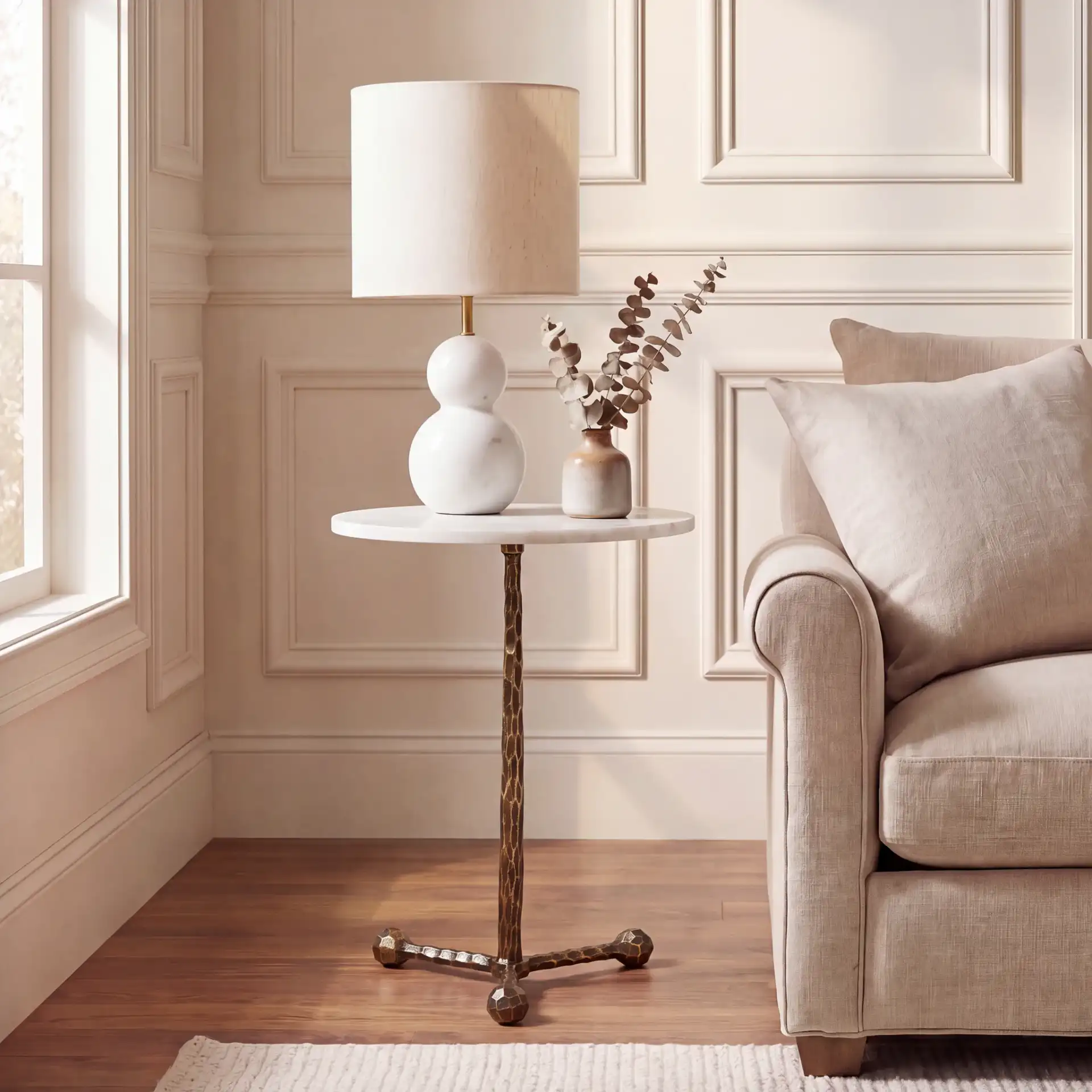 Sizia Round Accent Table in White Marble / Antique Brass in a styled room