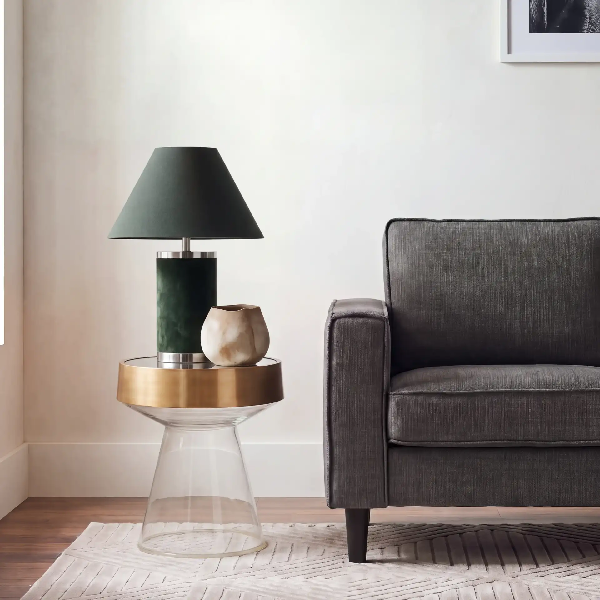 Szabo Round Accent Table in Gold / Clear in a styled room