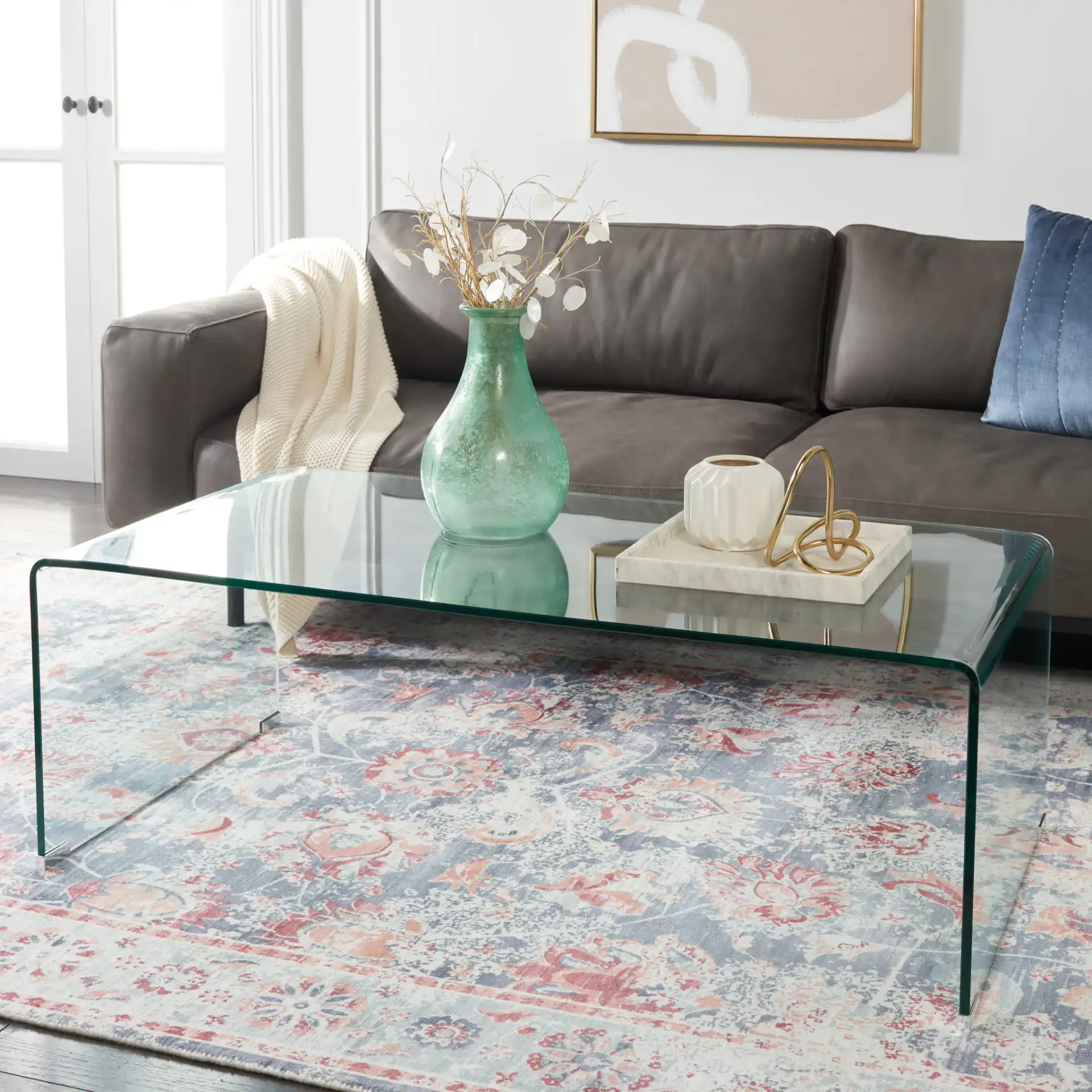 Willow Glass Coffee Table in Clear in a styled room
