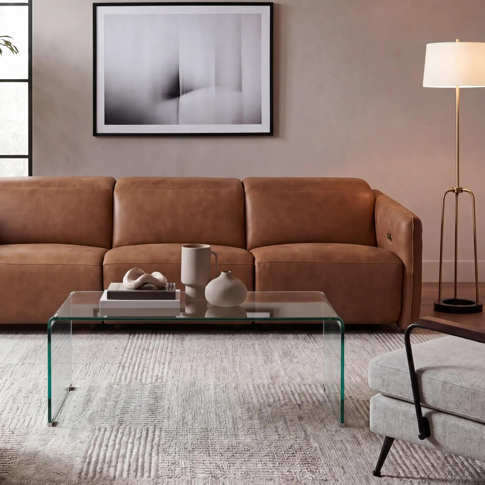 Willow Glass Coffee Table in Clear in a styled room