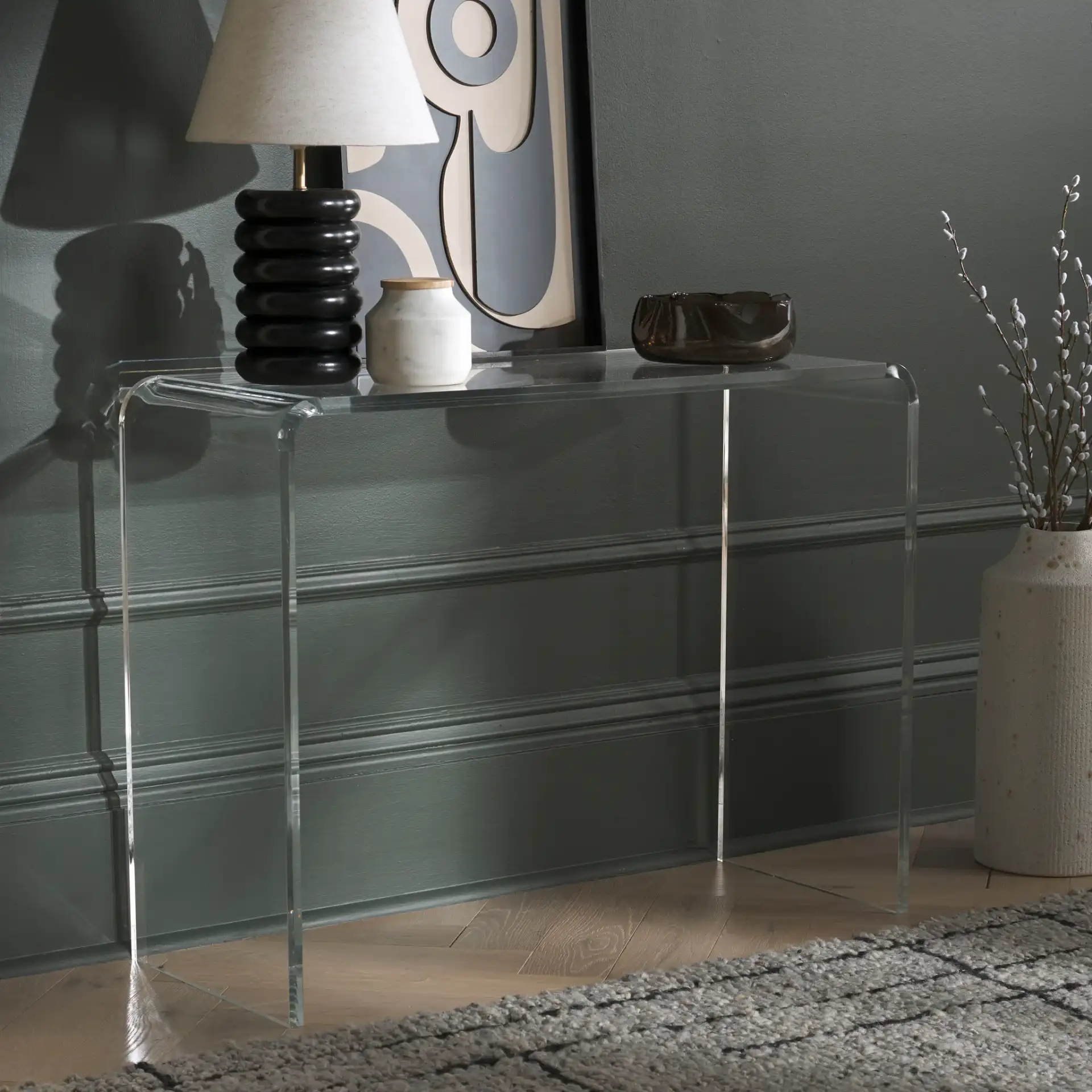 Atka Acrylic Console Table in Clear in a styled room