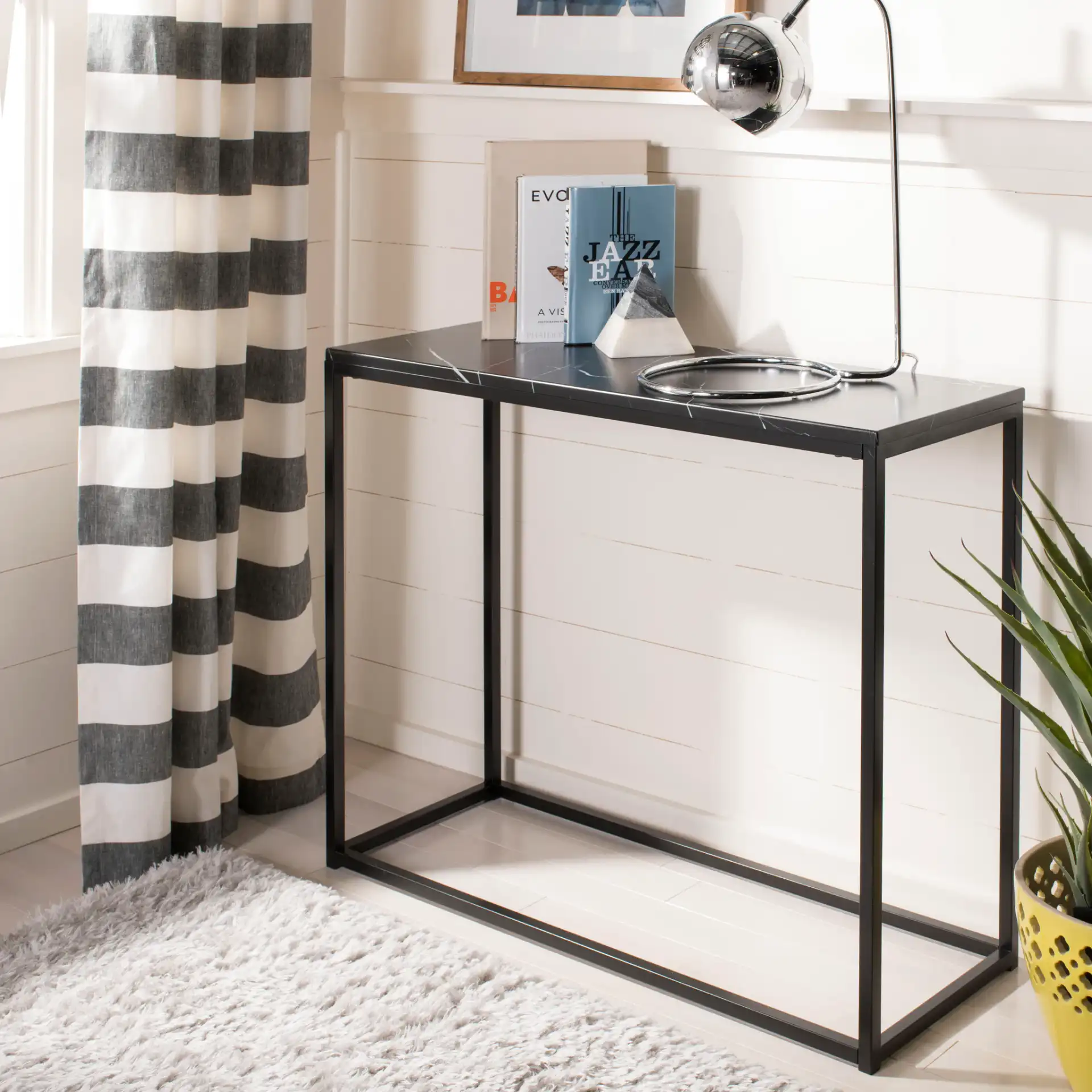 Baize Console in Black in a styled room