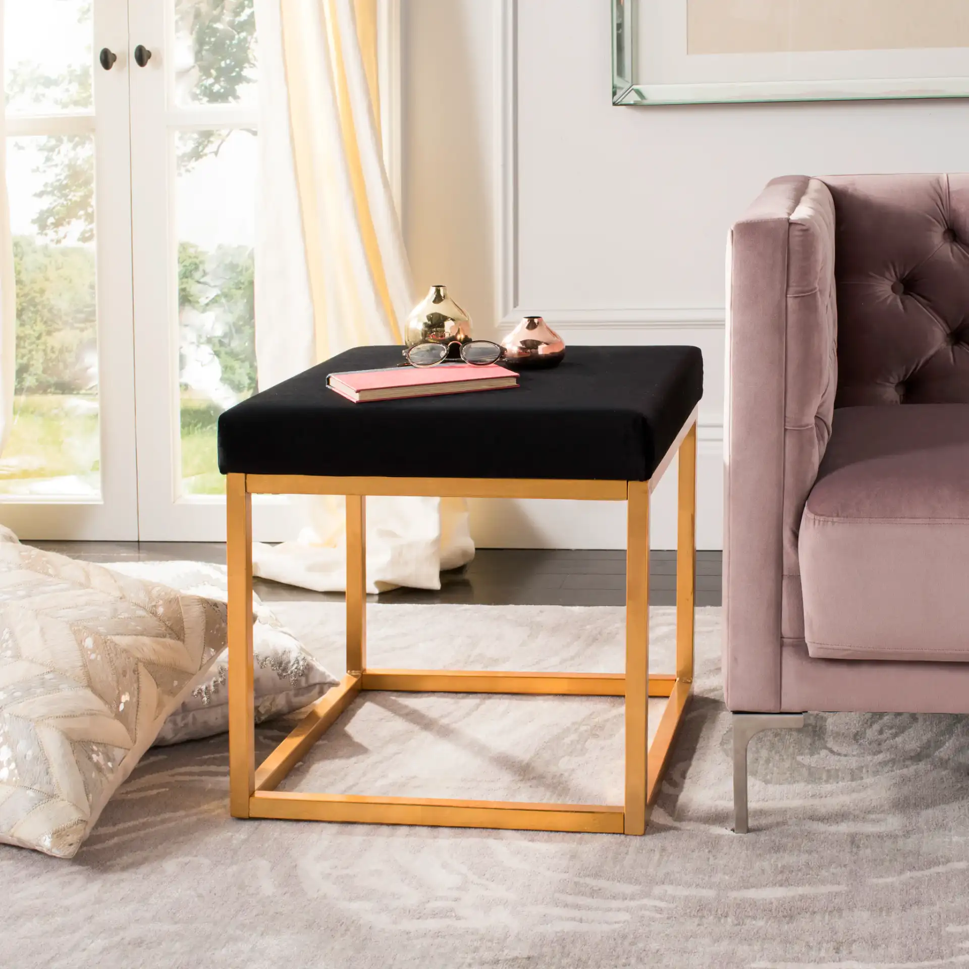 Rowan Square Ottoman in Black / Gold in a styled room