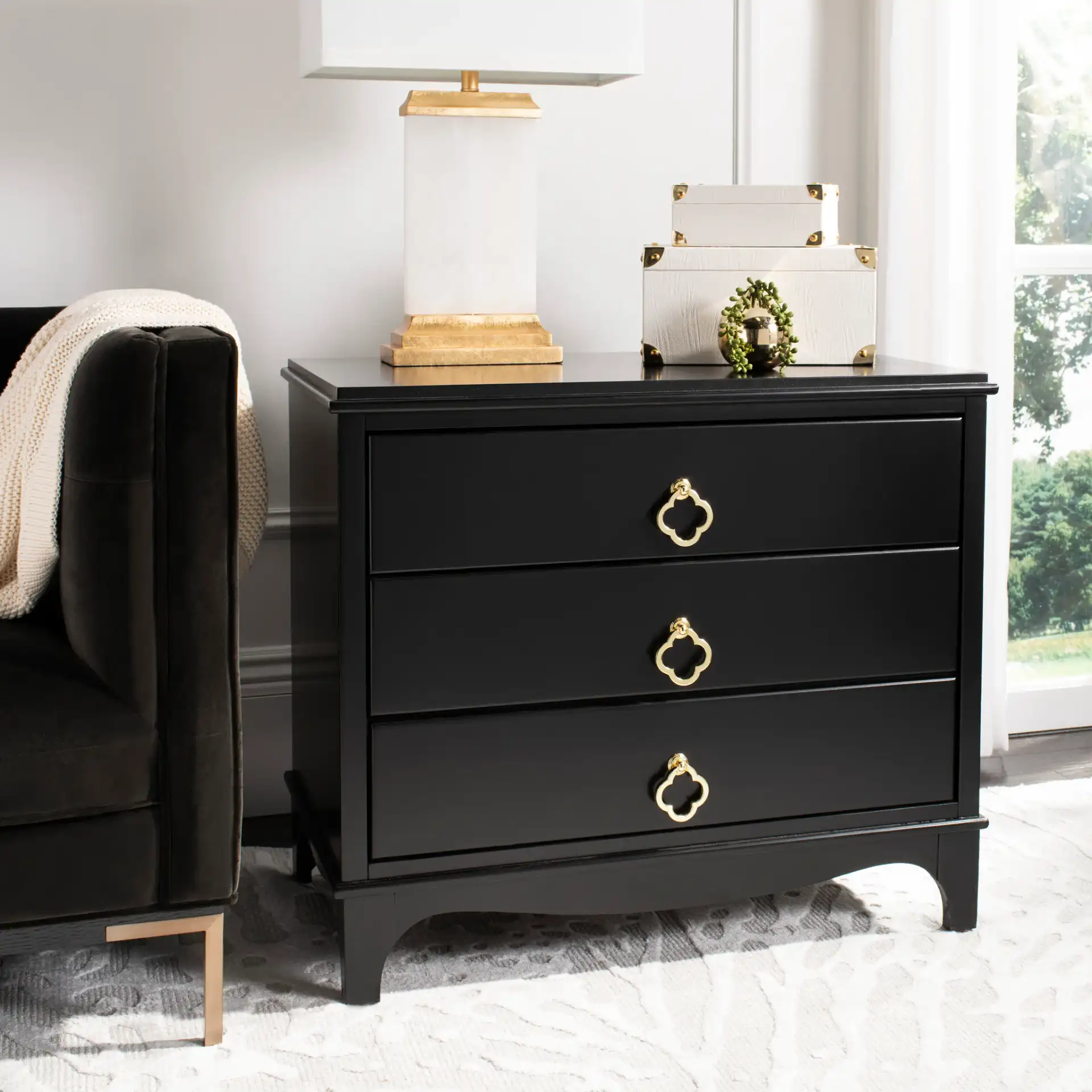 Hannon Nightstand in Black / Brass in a styled room