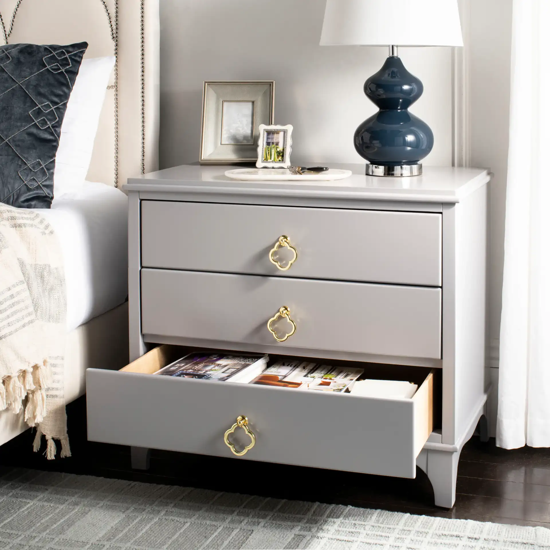 Hannon Nightstand in Black / Brass in a styled room