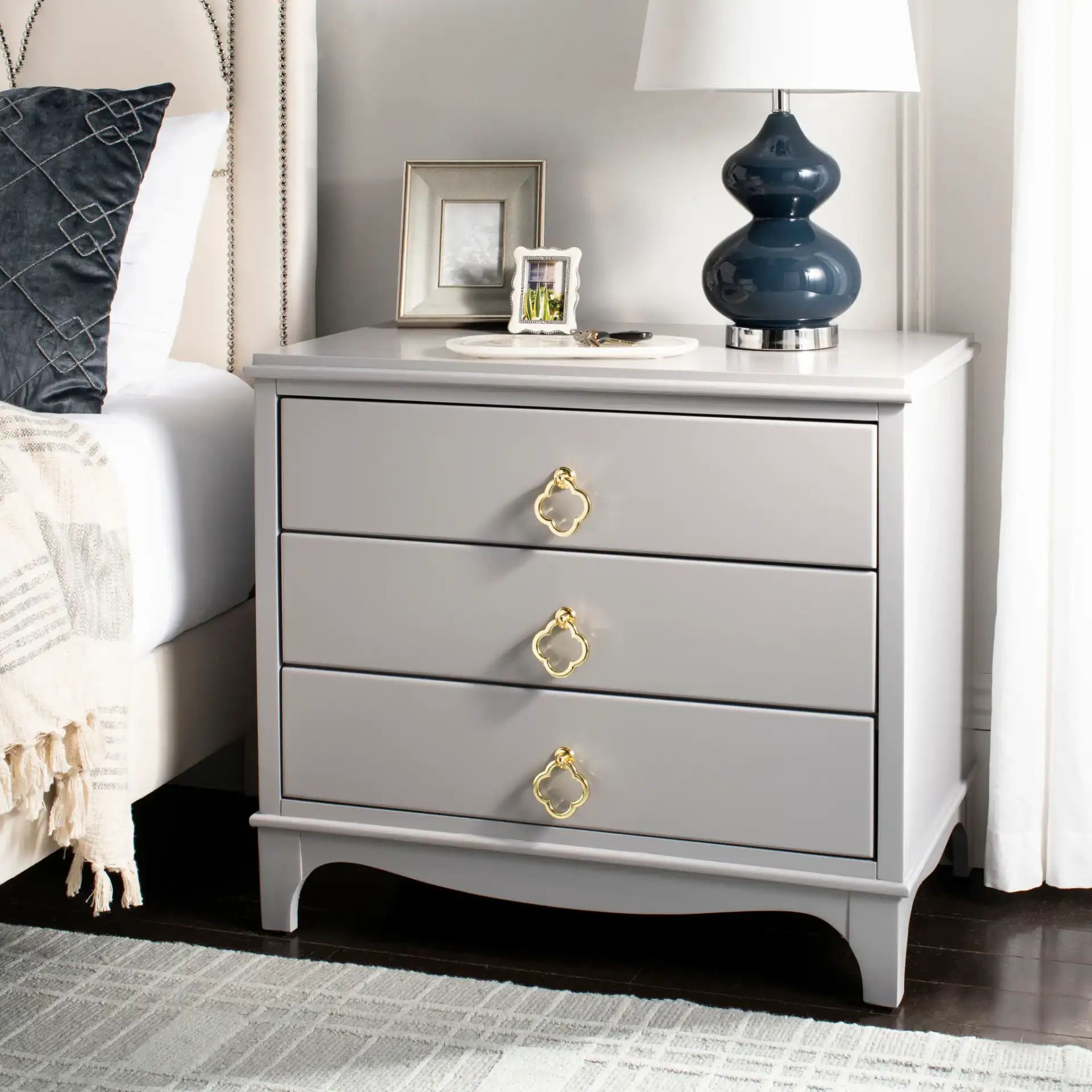 Hannon Nightstand in Black / Brass in a styled room
