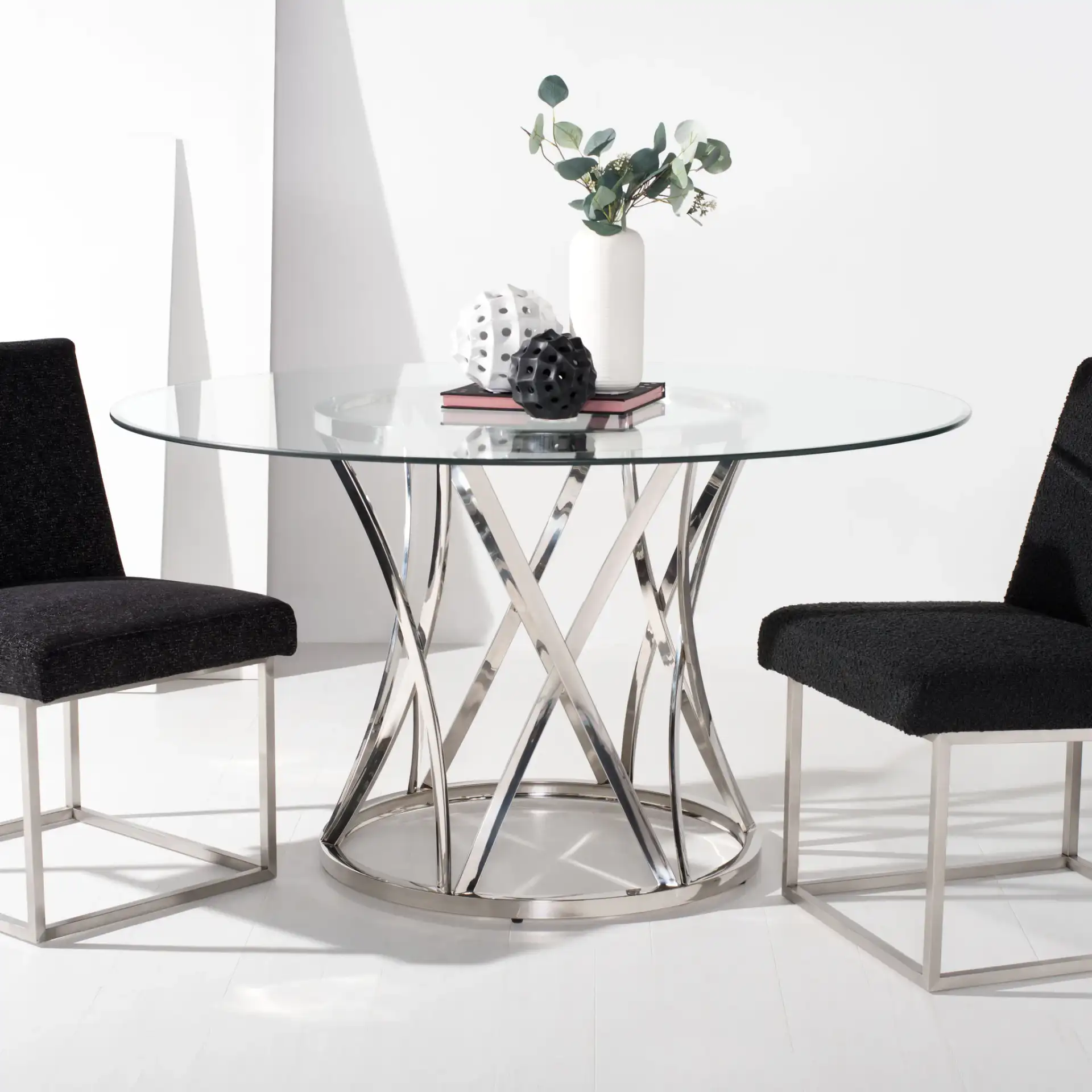 Kyrie 54-Inch Glass Dining Table in Chrome in a styled room