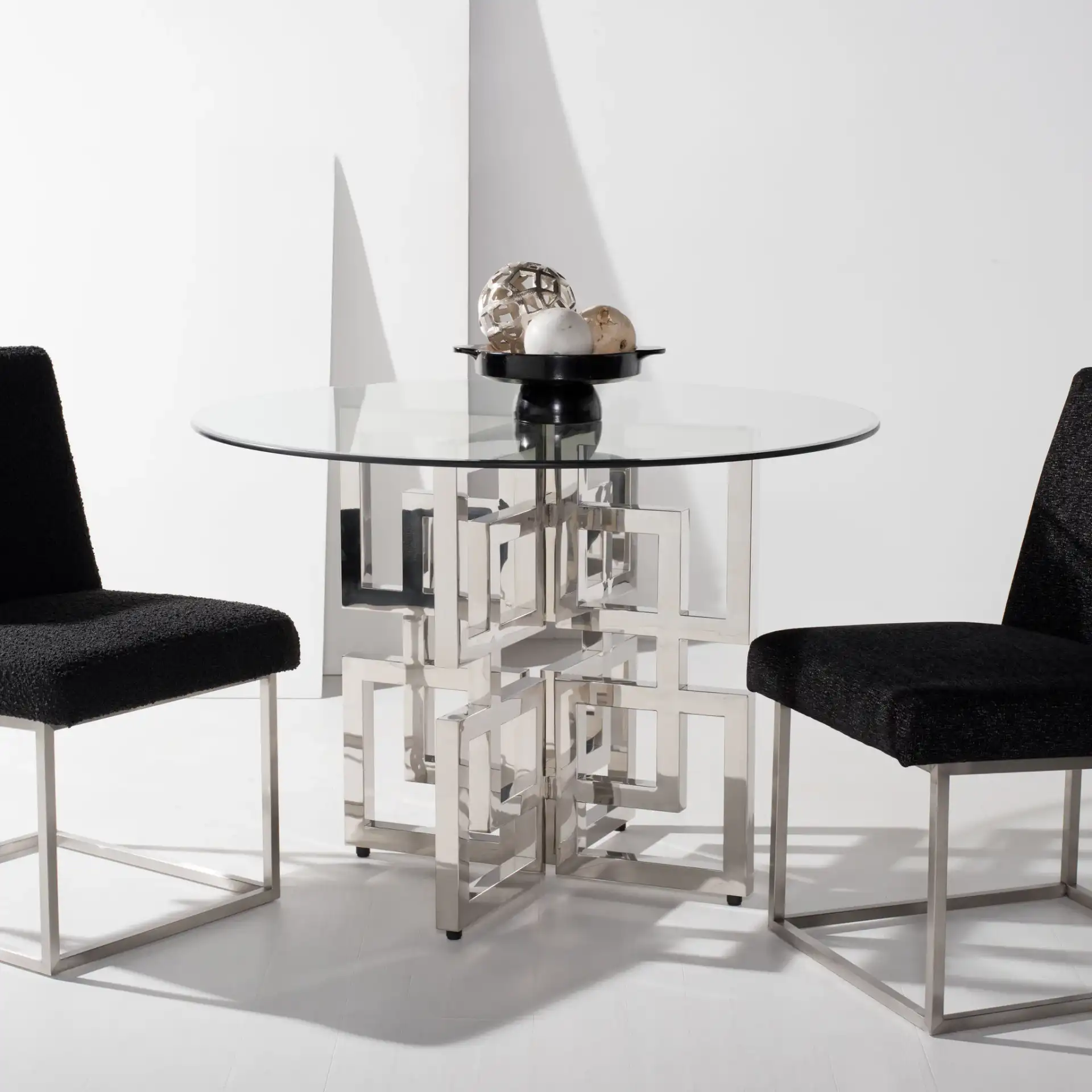 Harlan Glass Top Dining Table in Chrome in a styled room