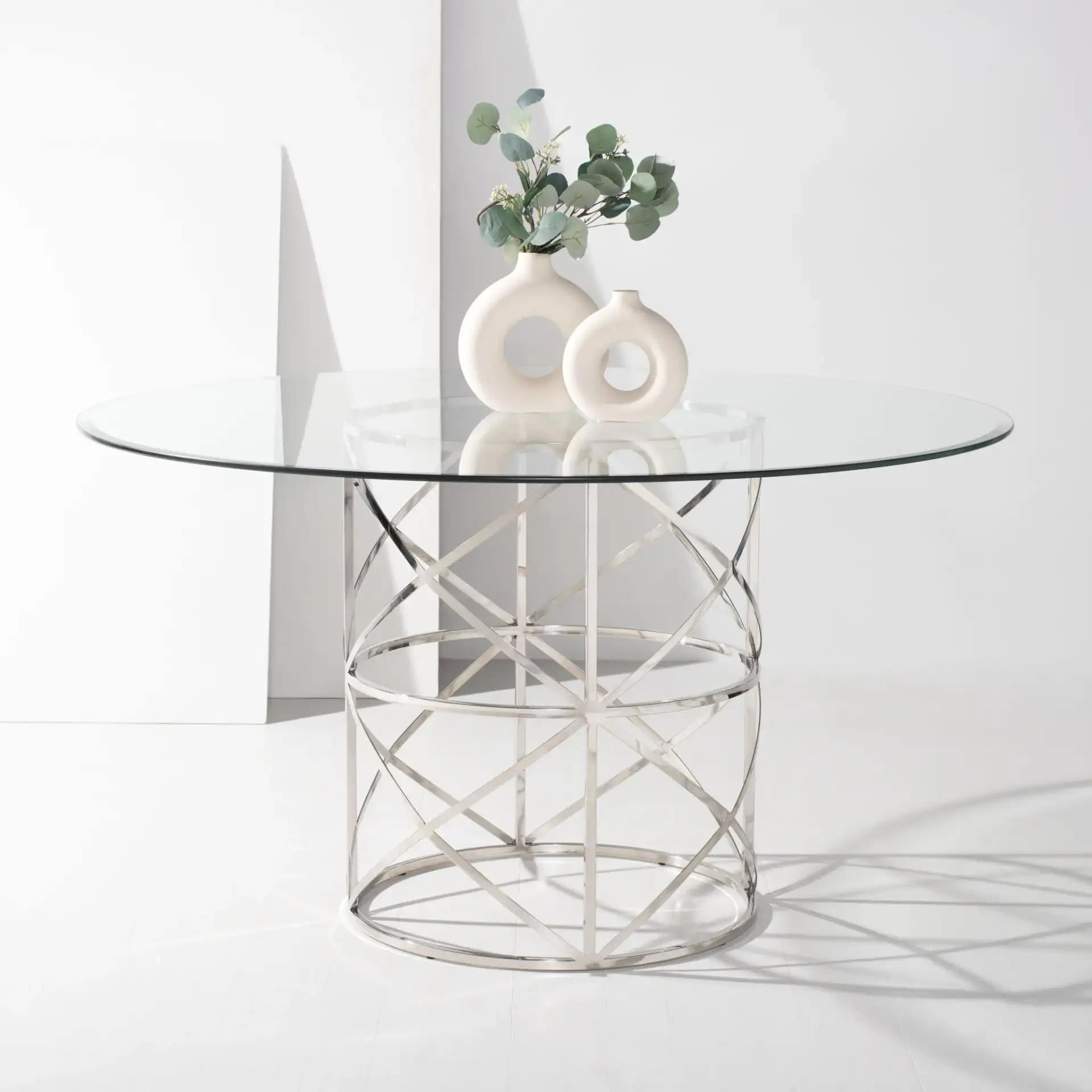 Ren 54" Glass Top Dining Table in Chrome in a styled room