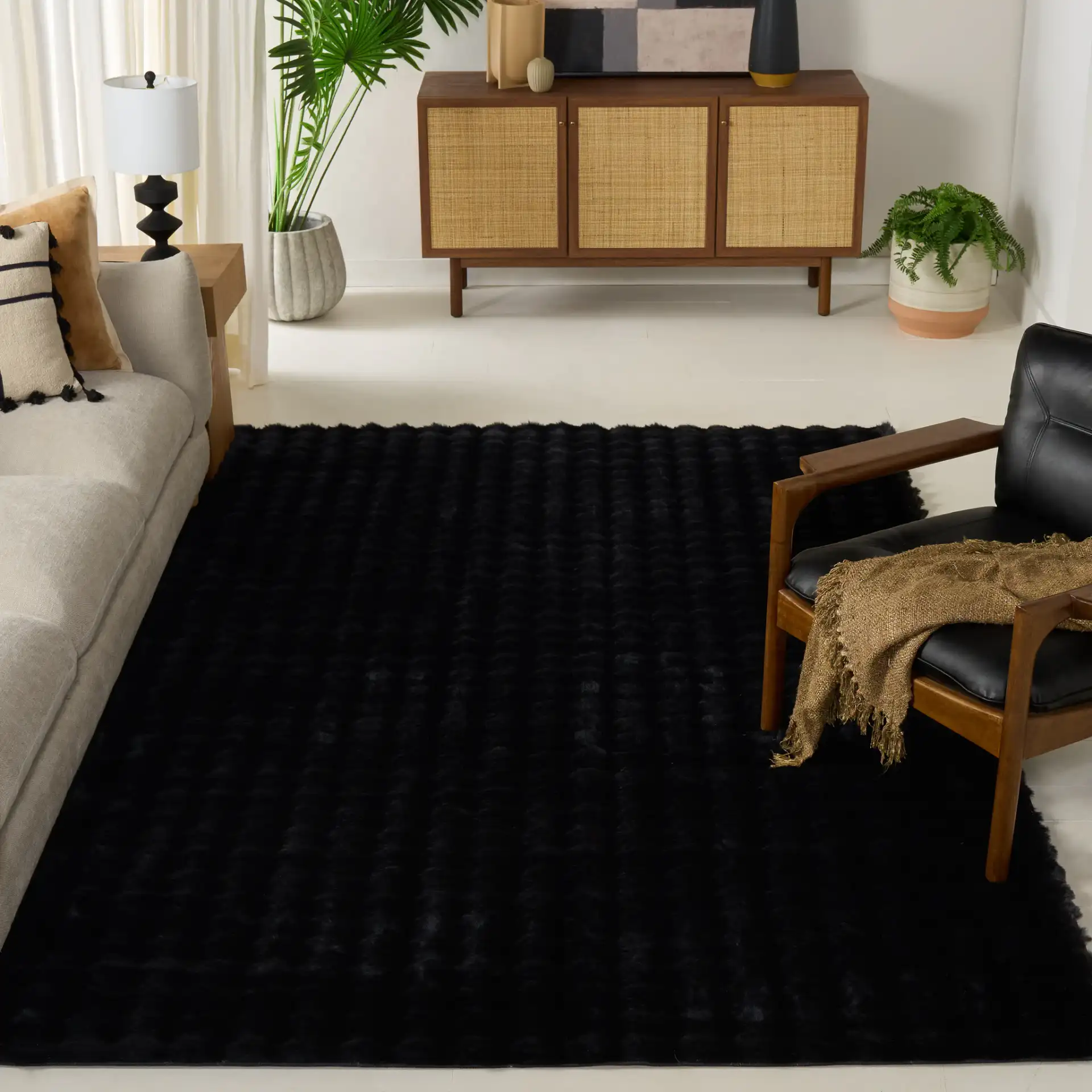 Faux Rabbit Bubble Textured Solid Washable Rug in Black in a styled room