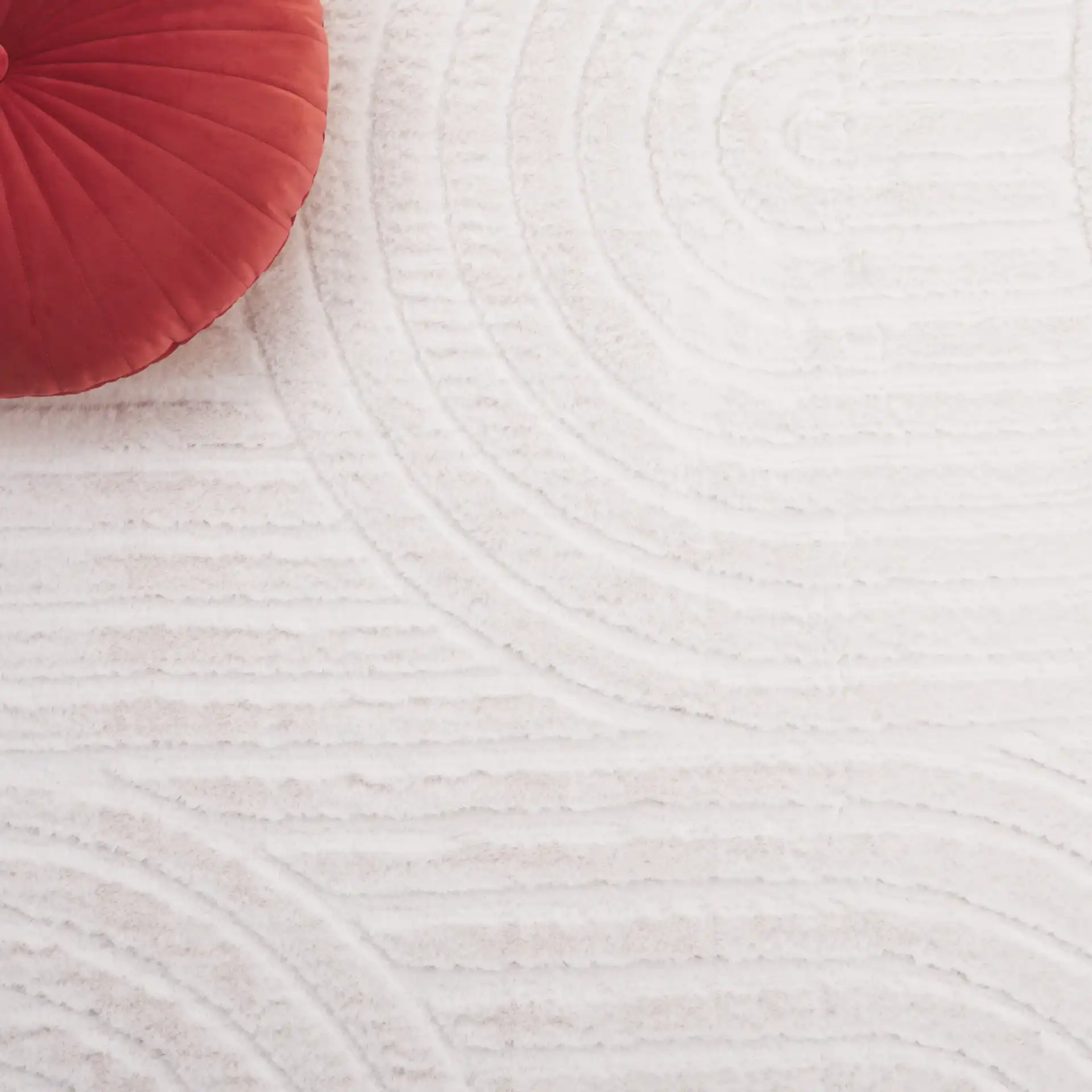 Faux Rabbit Fur Concentric Arches Washable Rug in Ivory in a styled room