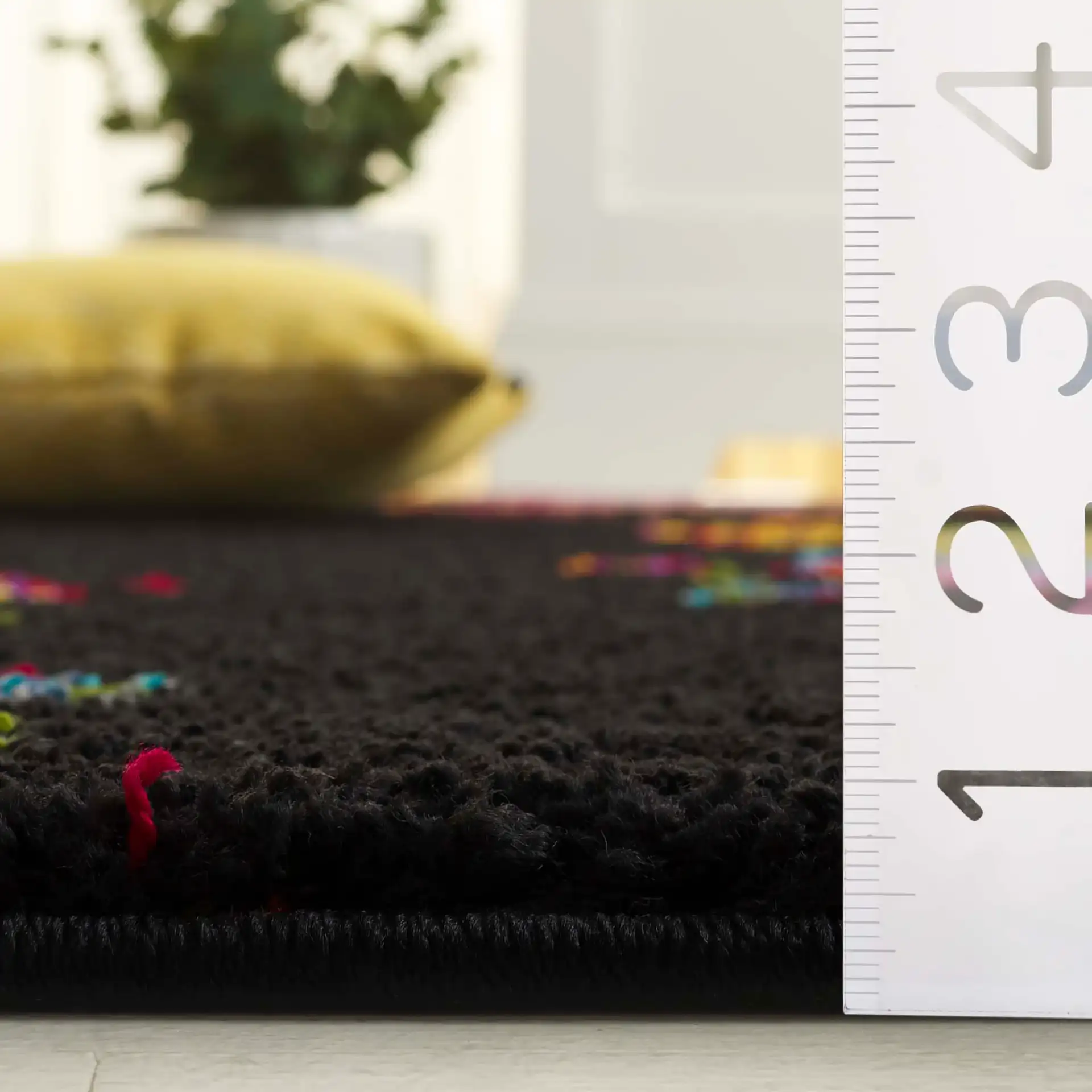 Fiesta Butterfly Shag Rug in Black / Yellow in a styled room