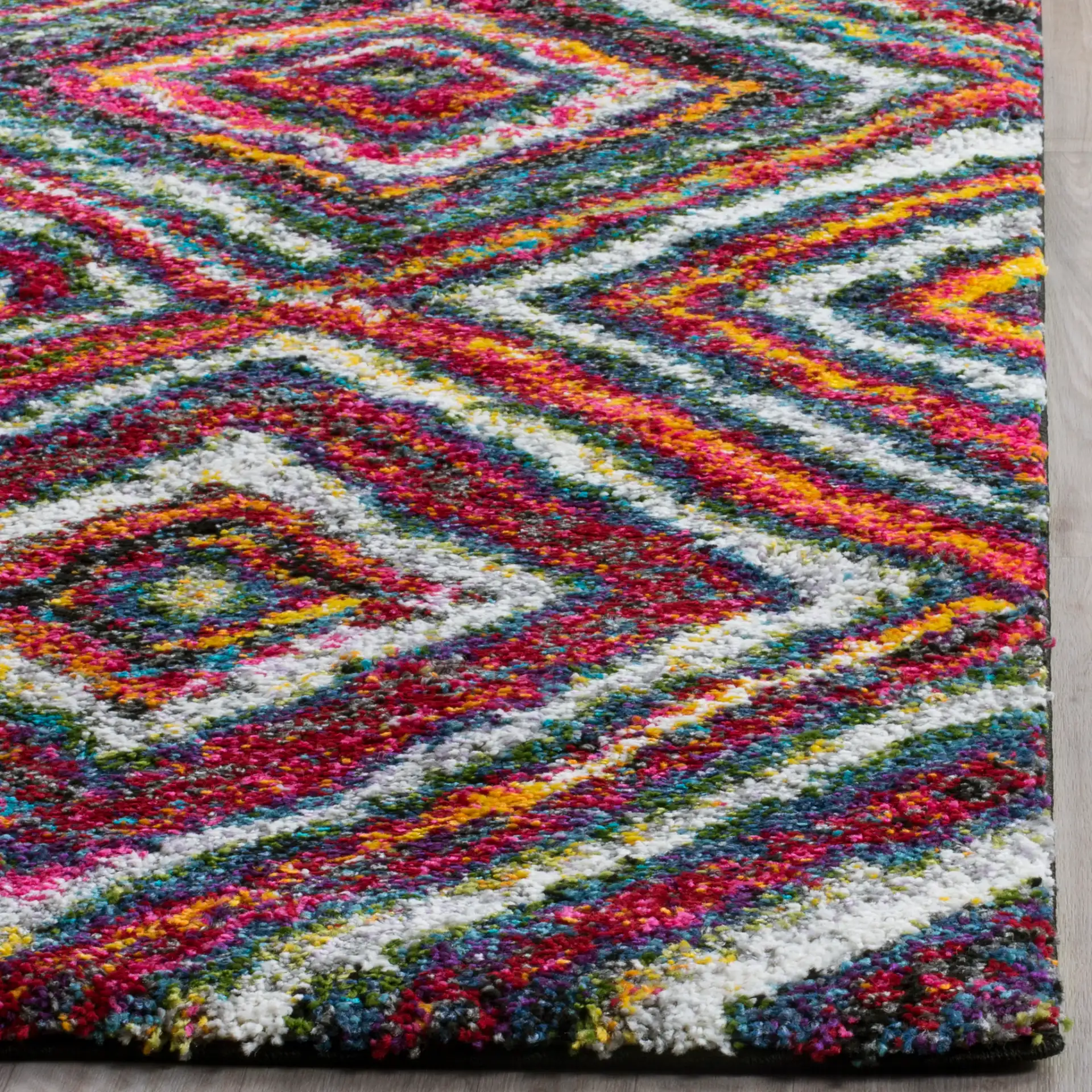 Fiesta Concentric Diamond Shag Rug in Multicolor in a styled room