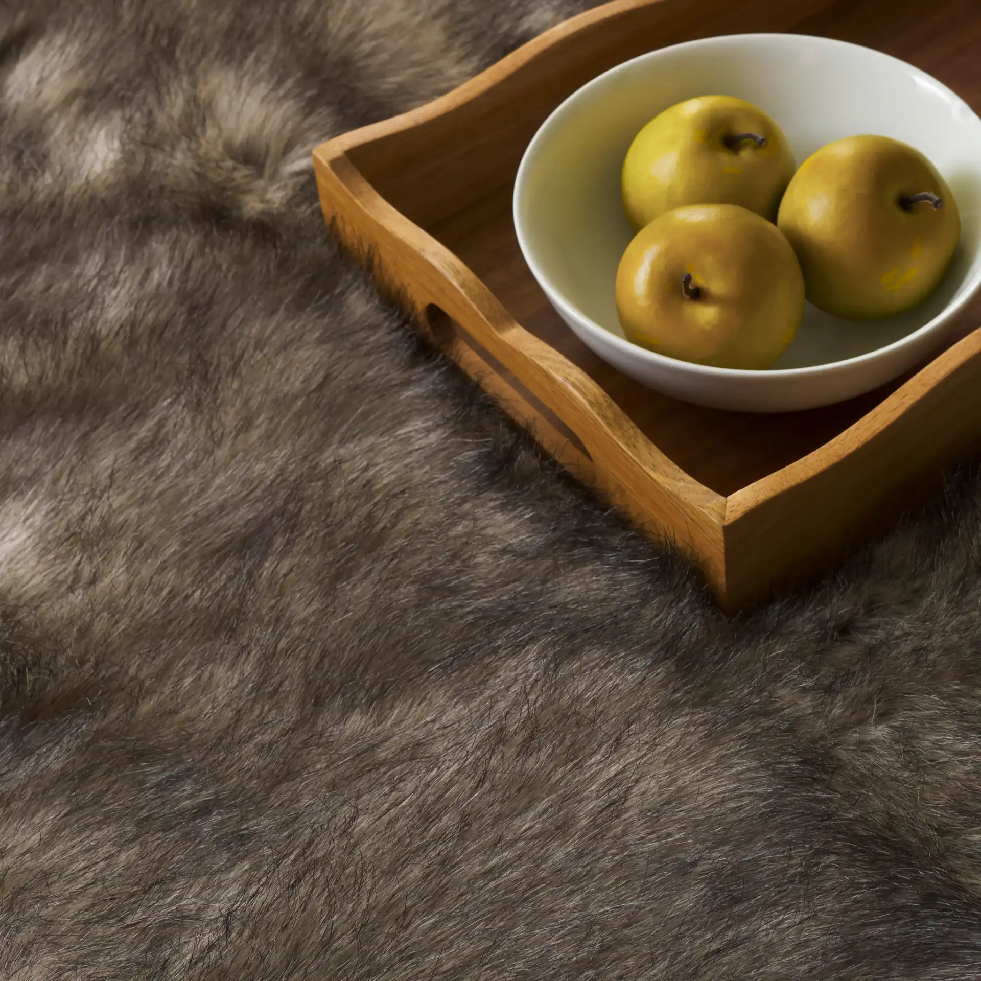 Faux Sheep Skin Solid Shag Rug in Gray / Black in a styled room