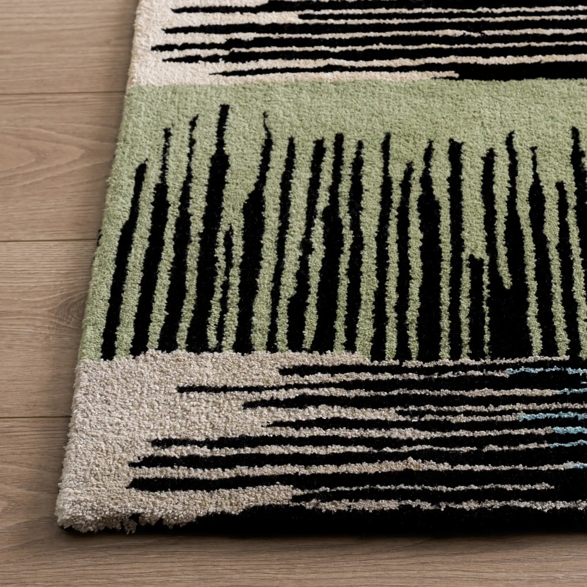 Fifth Avenue Abstract Hatch Block Hand-Tufted Rug in Black / Pink in a styled room