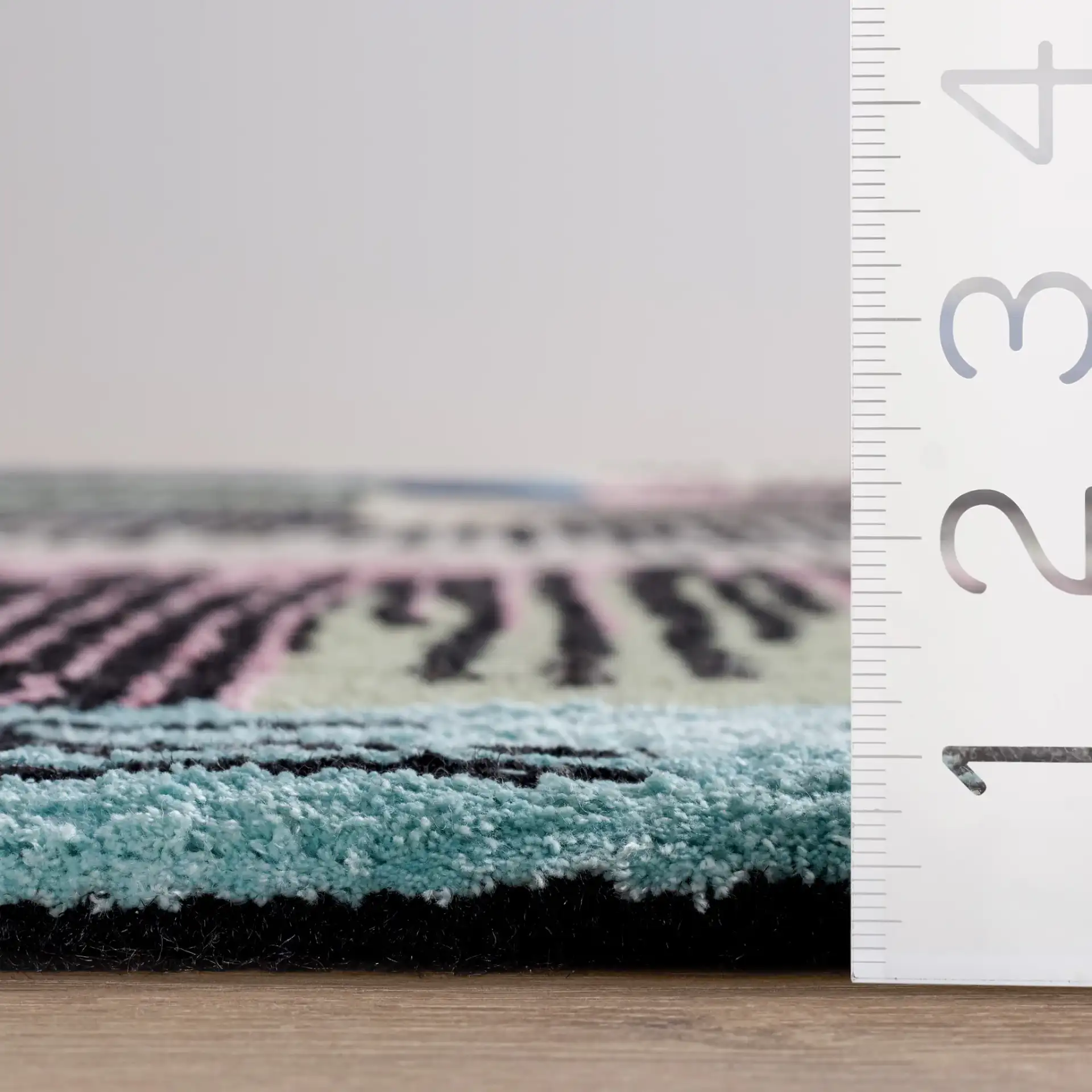 Fifth Avenue Abstract Hatch Block Hand-Tufted Rug in Black / Pink in a styled room
