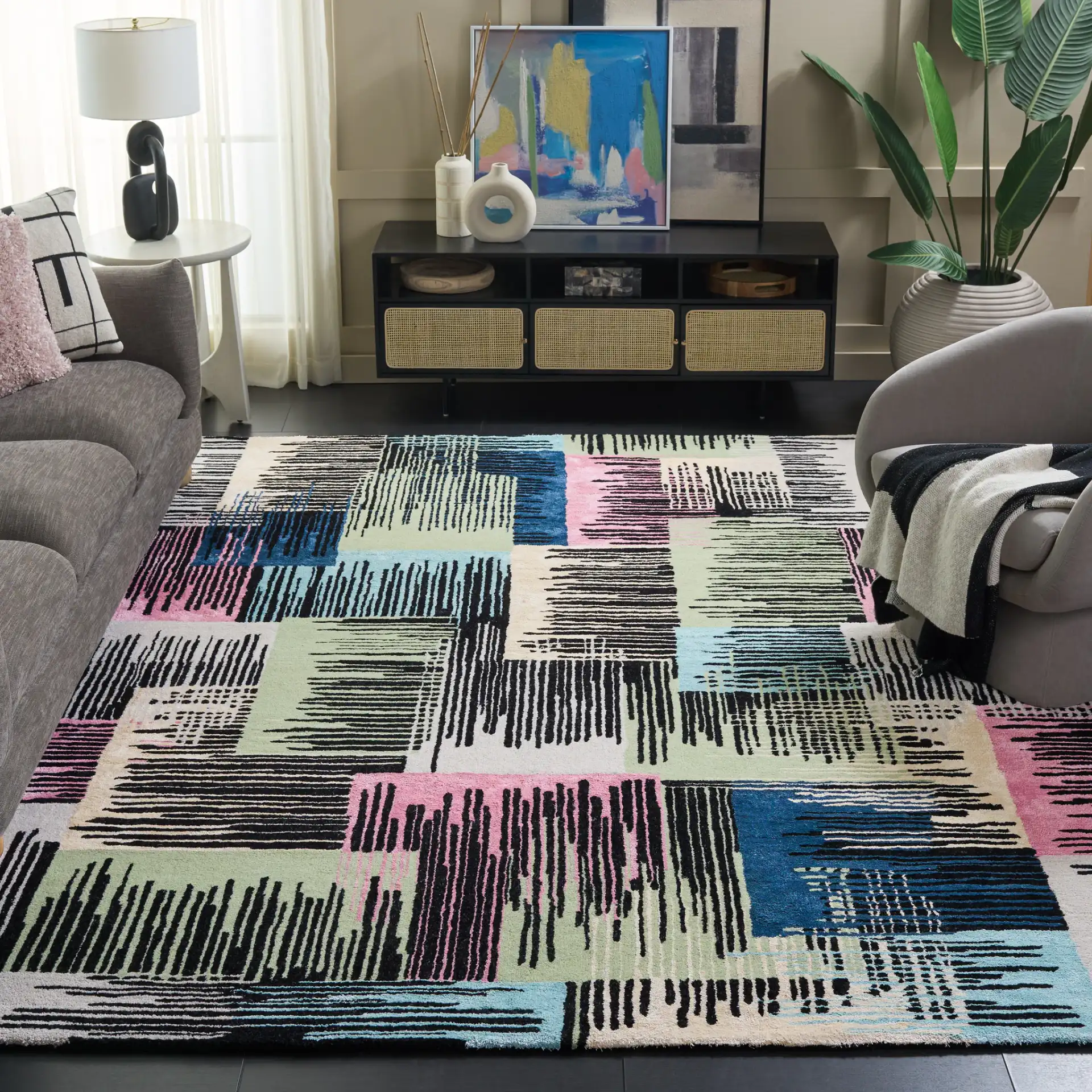 Fifth Avenue Abstract Hatch Block Hand-Tufted Rug in Black / Pink in a styled room