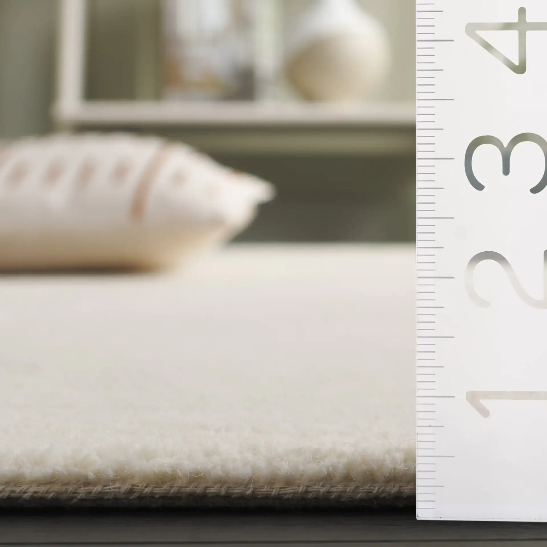 Fifth Avenue Wavy Line Hand-Tufted Rug in Ivory in a styled room
