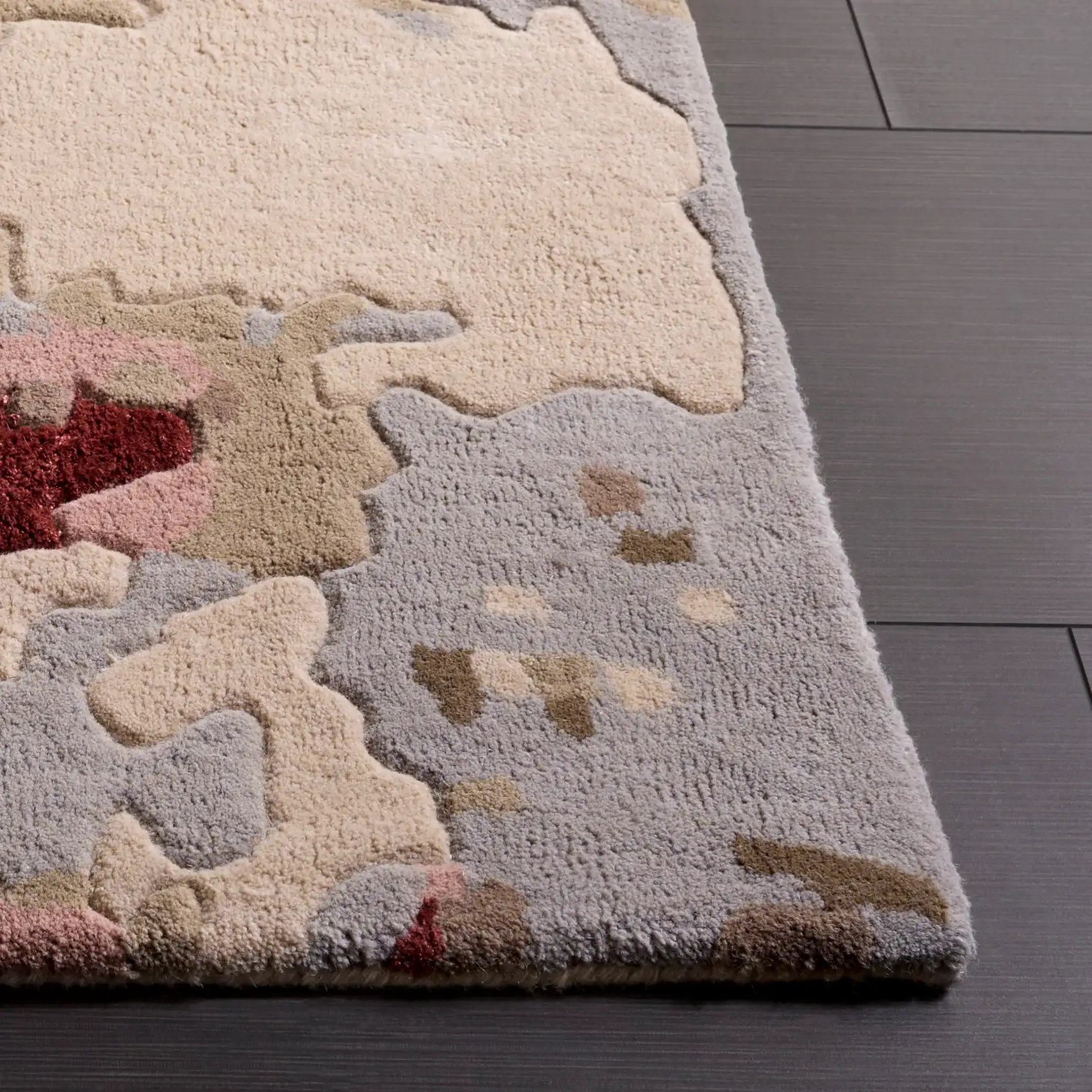 Fifth Avenue Abstract Pools Hand-Tufted Rug in Gray / Red in a styled room