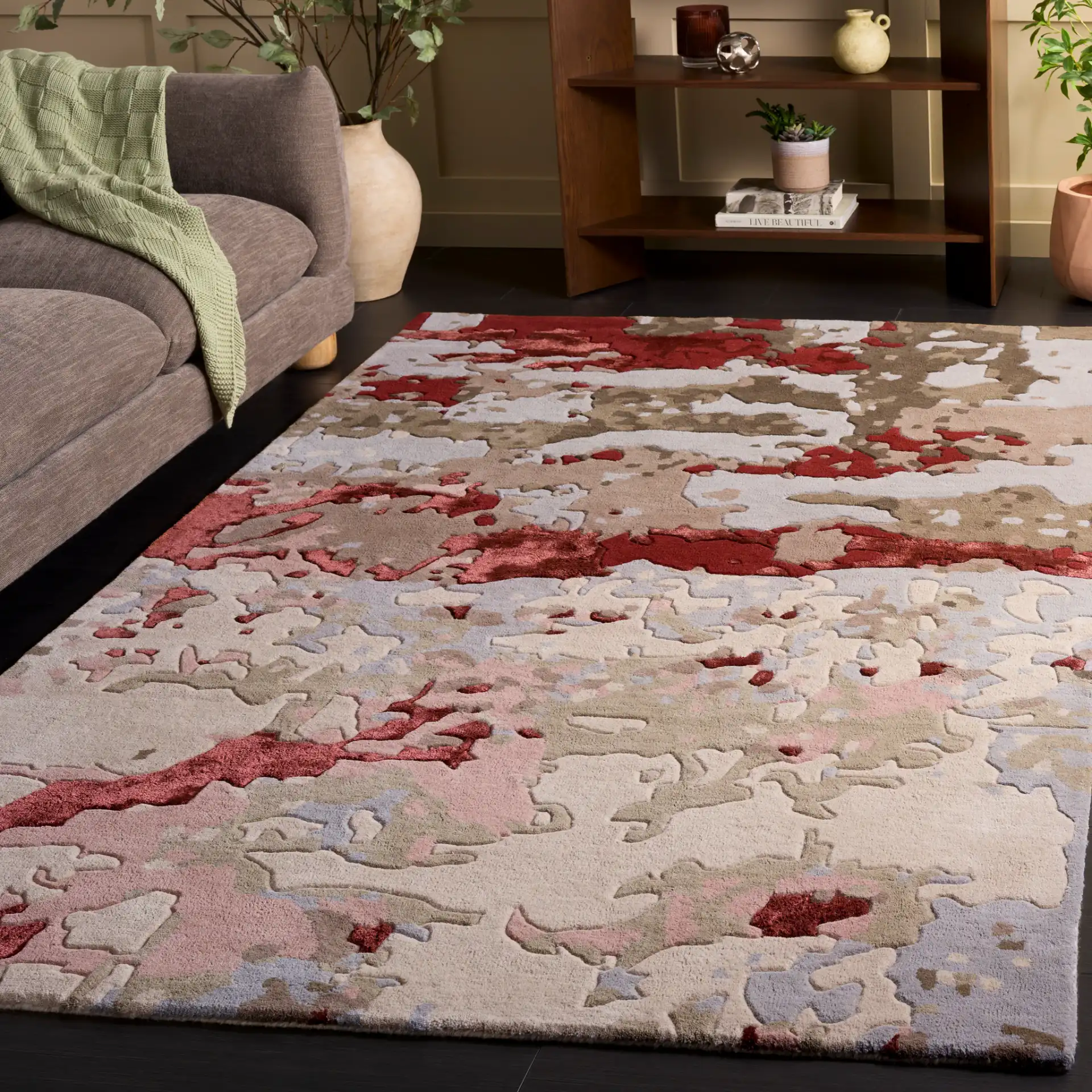 Fifth Avenue Abstract Pools Hand-Tufted Rug in Gray / Red in a styled room