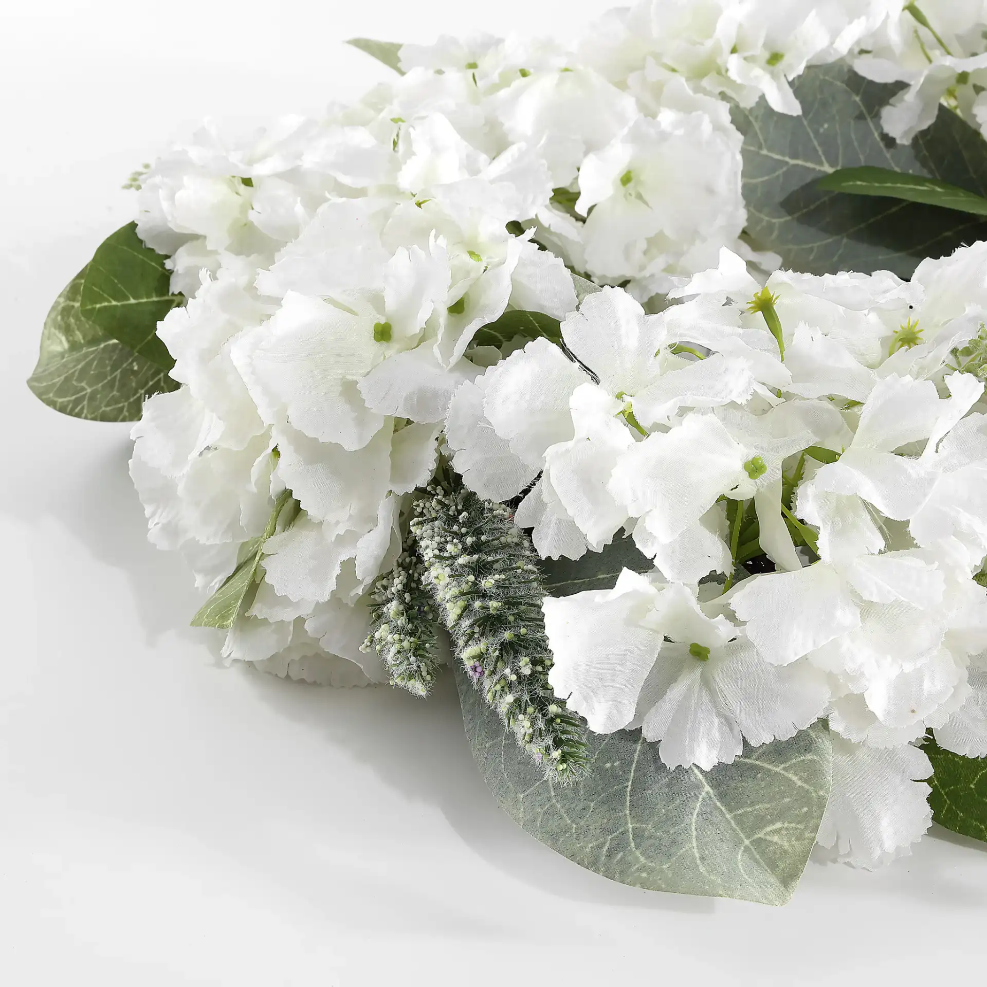 Faux 22" Hydrangea & Magnolia Wreath in White / Green in a styled room