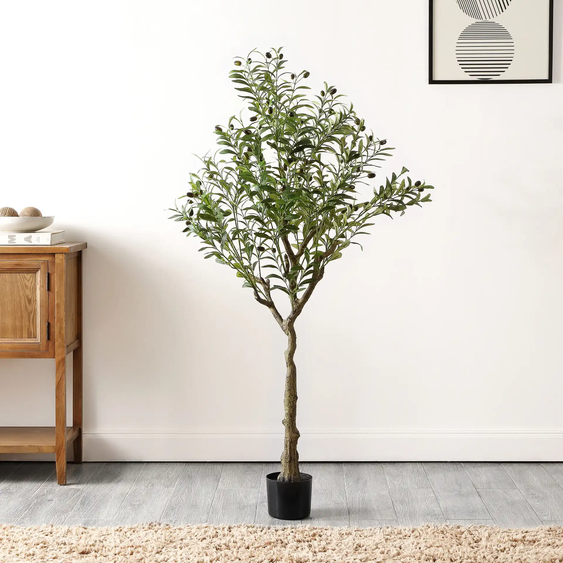 Faux 60" Potted Olive Tree in Green in a styled room