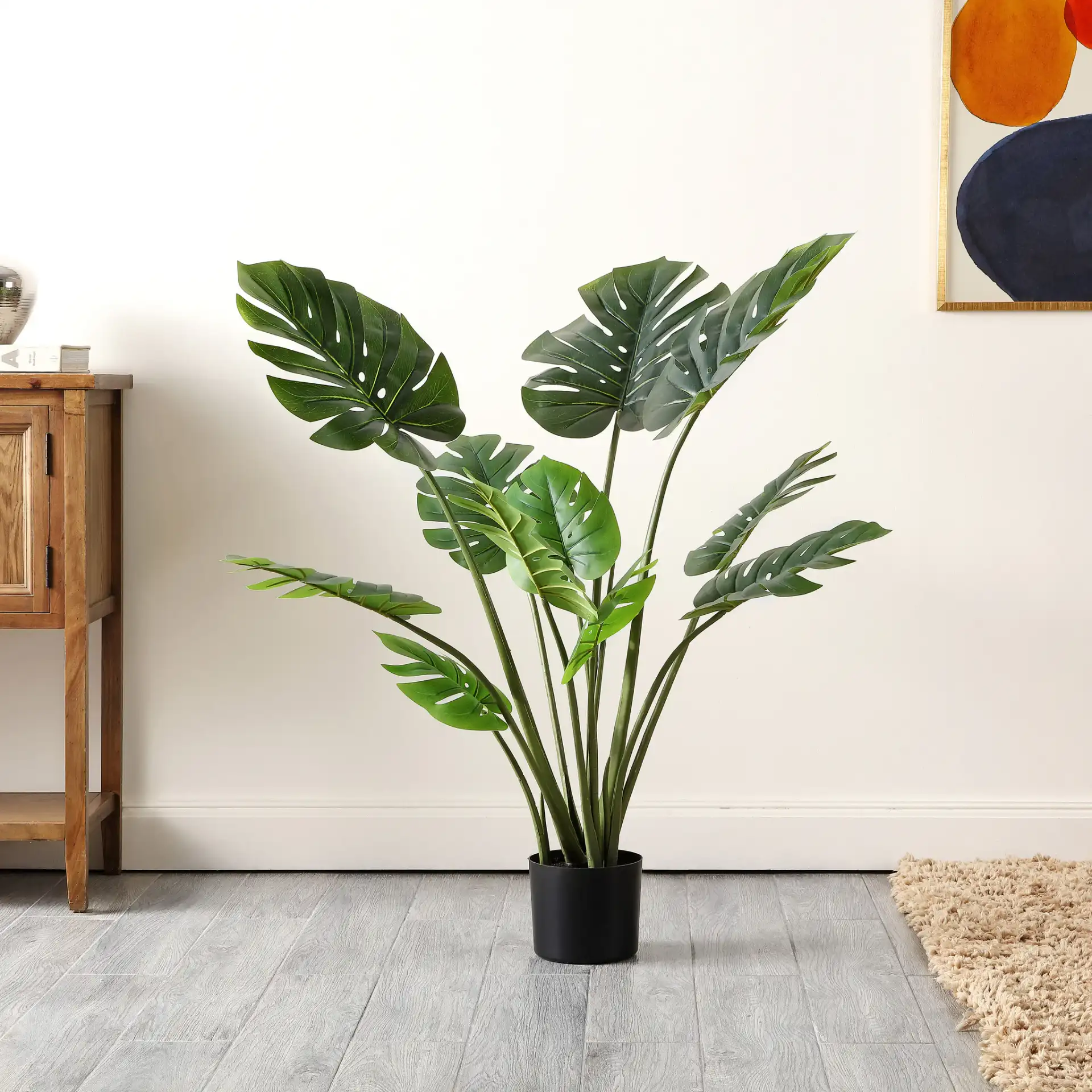 Faux 43" Potted Monstera Tree in Green in a styled room