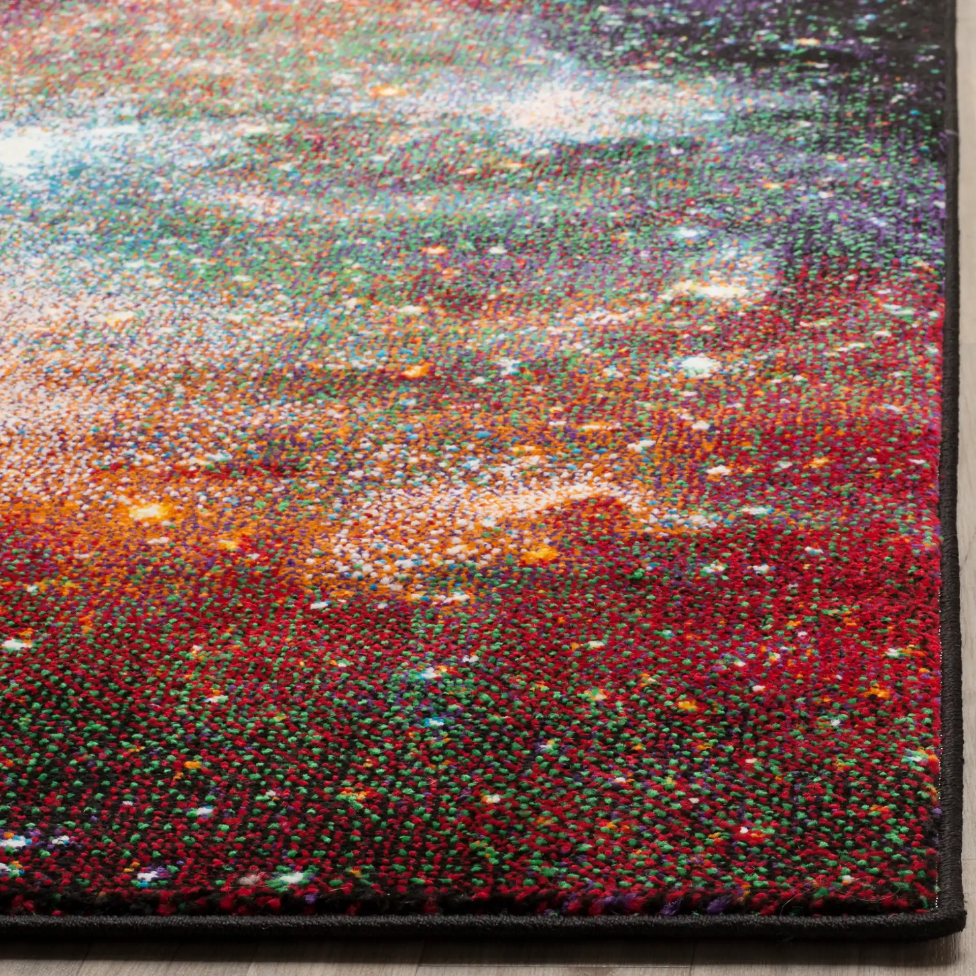 Galaxy Nebula Rug in Purple / Multicolor in a styled room